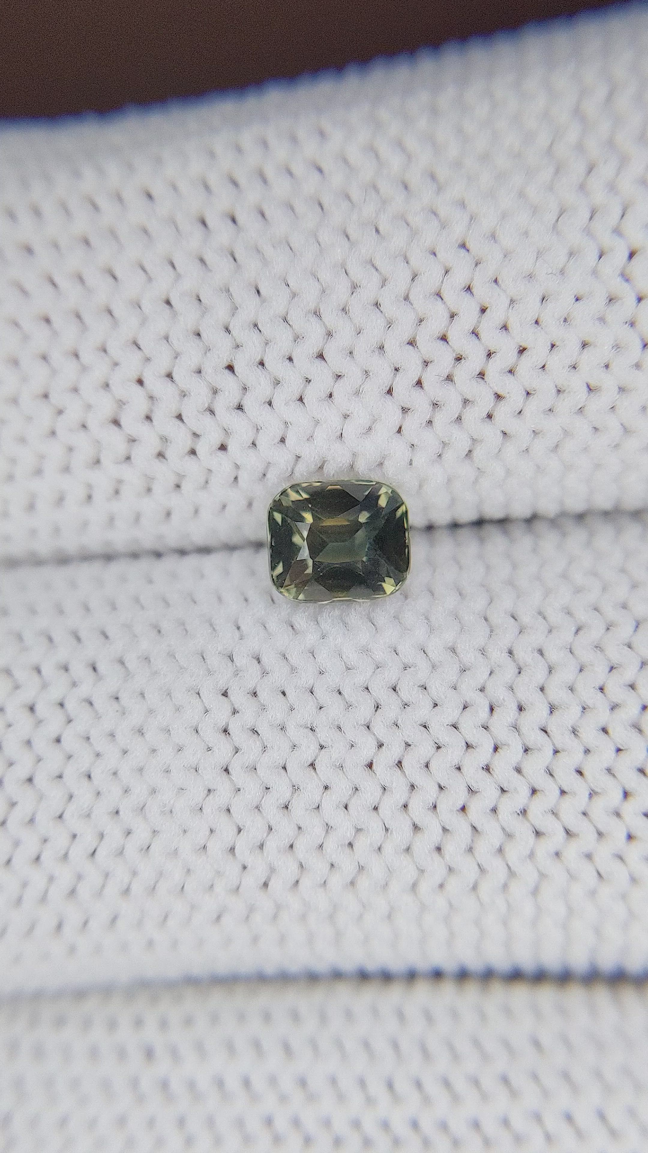 0.88 Ct. Brownish Green Sapphire from Madagascar Size Video