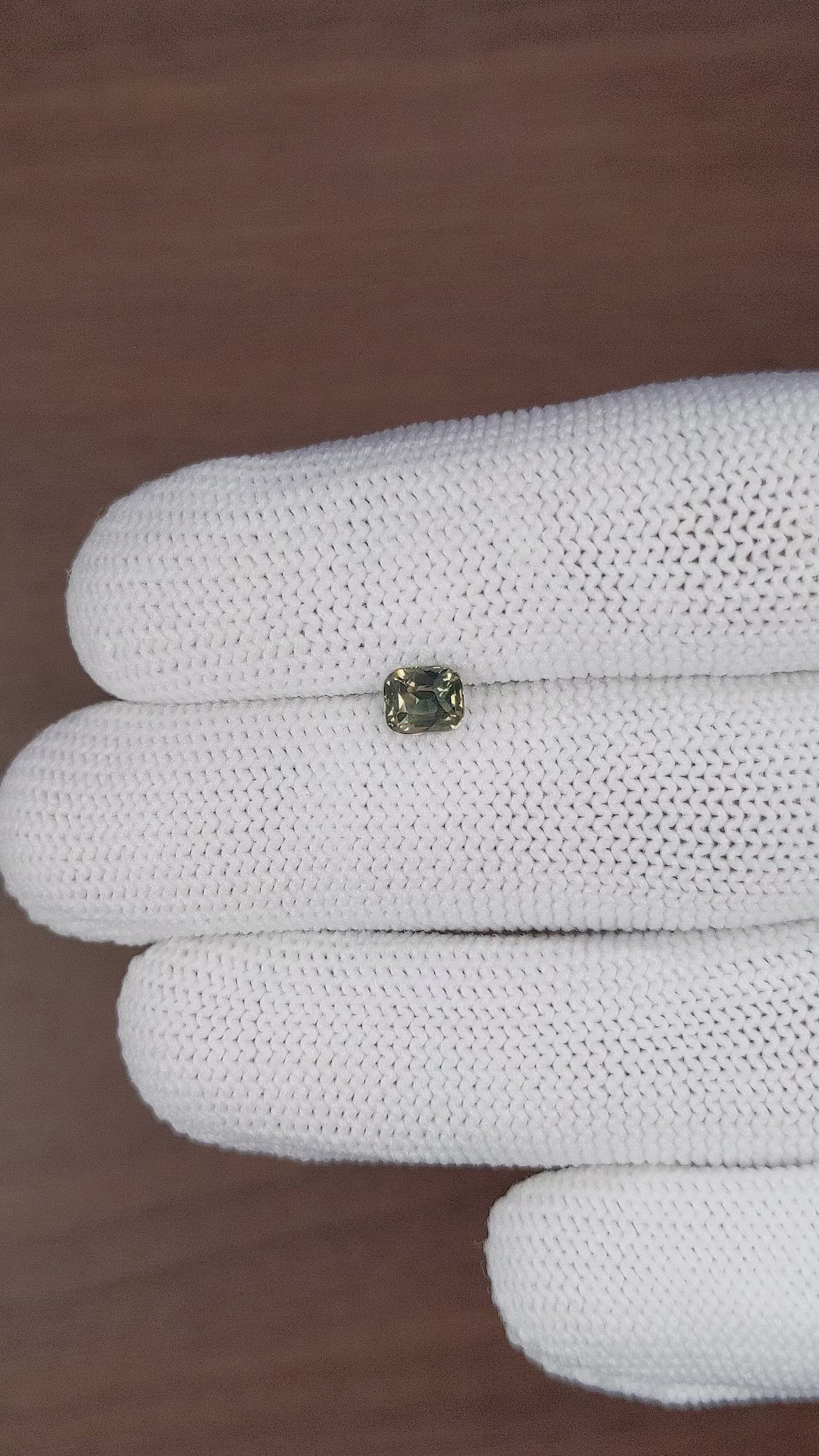 0.88 Ct. Brownish Green Sapphire from Madagascar Size Video