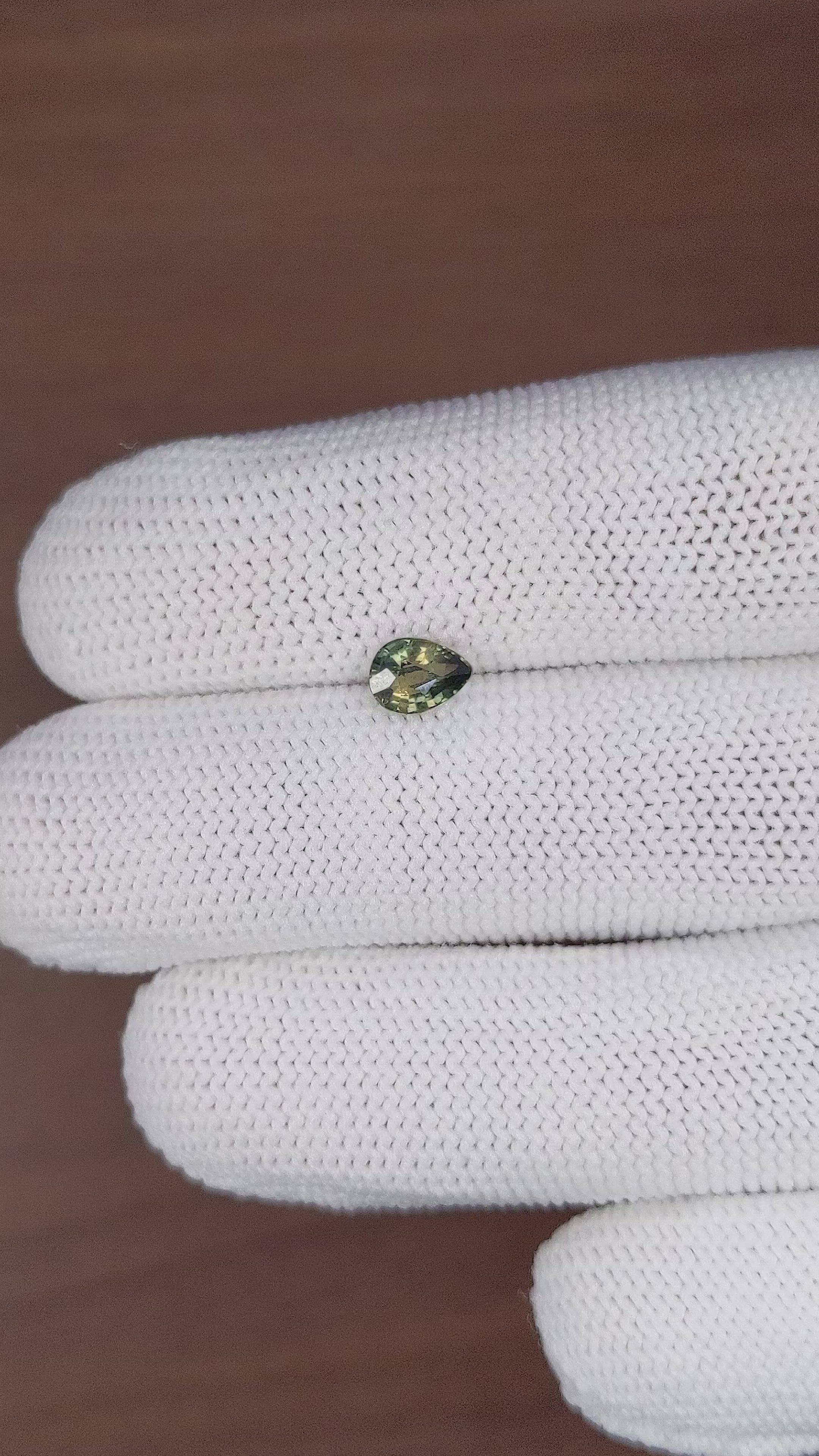 0.81 Ct. Yellowish Green Sapphire from Madagascar Size Video