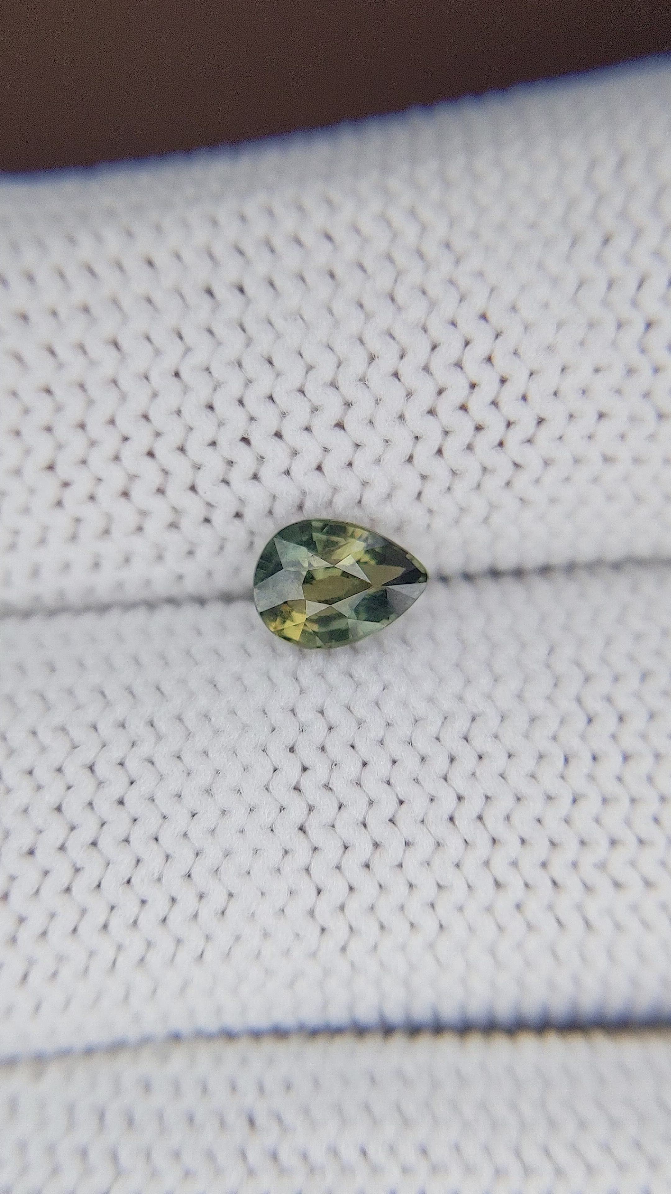 0.81 Ct. Yellowish Green Sapphire from Madagascar Size Video