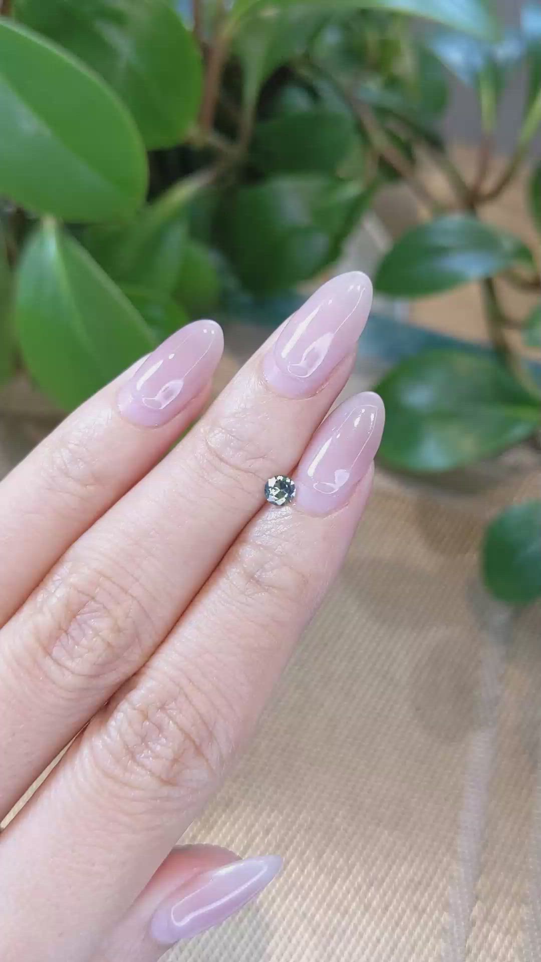 0.26 Ct. Yellowish Green Sapphire from Montana Size Video