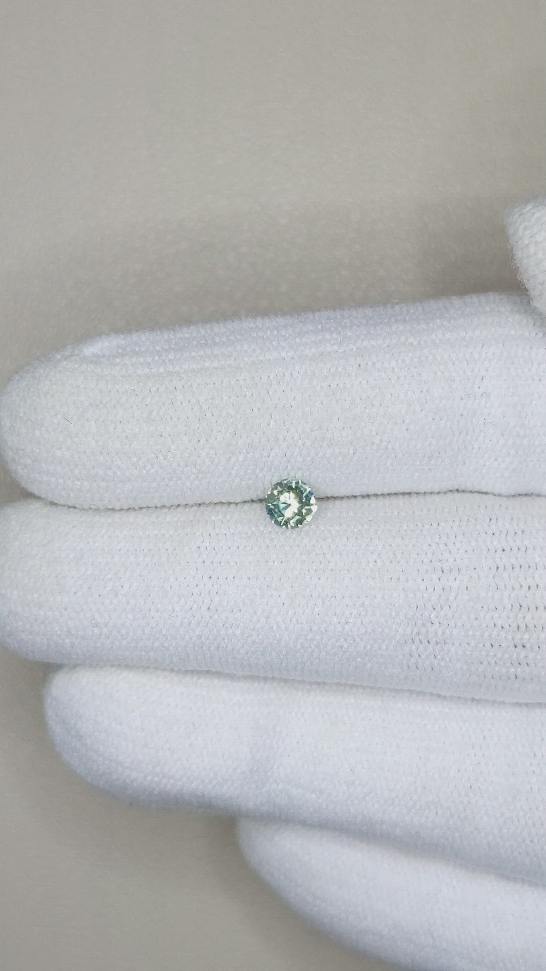 0.26 Ct. Yellowish Green Sapphire from Montana Size Video