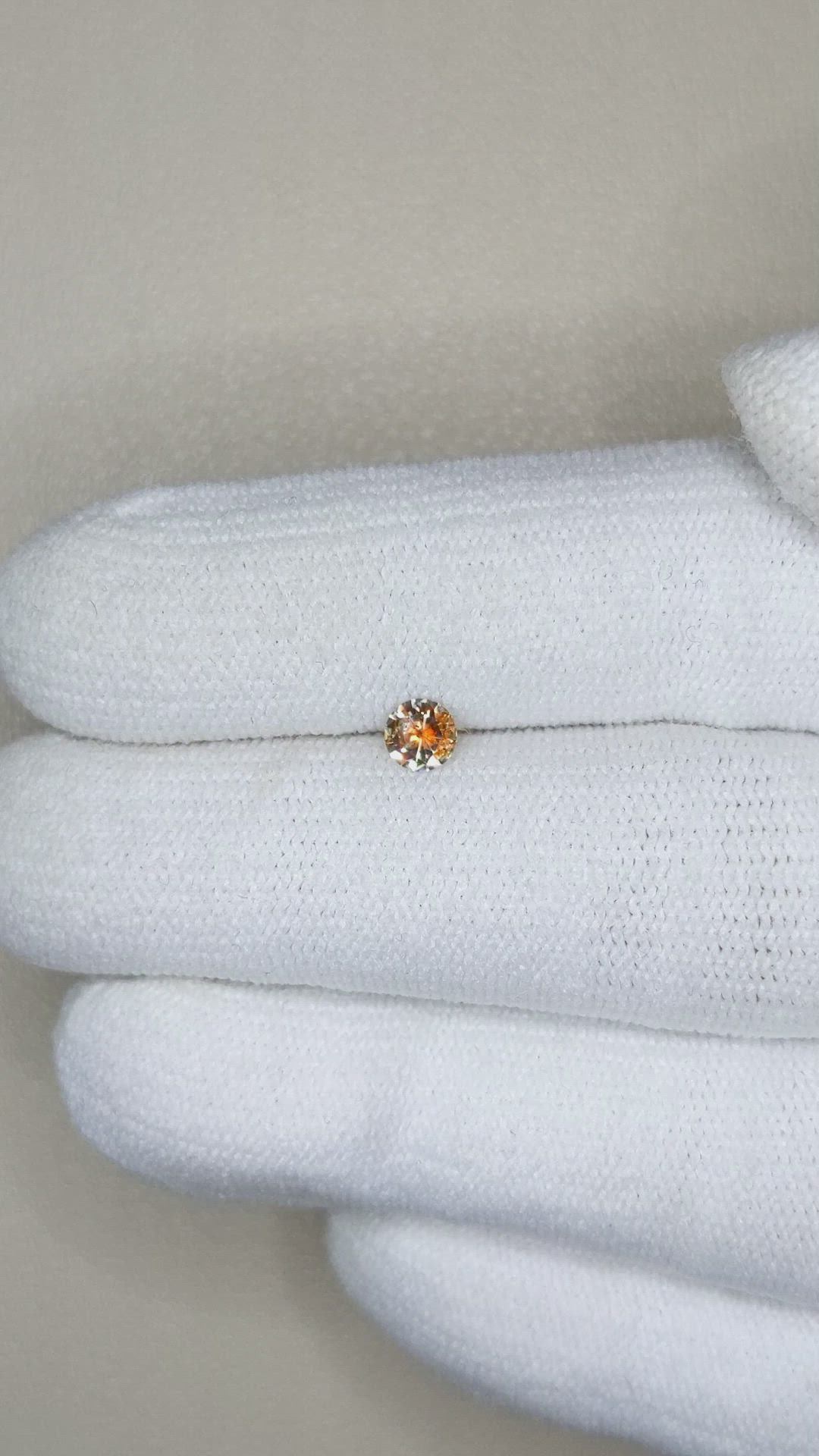 0.26 Ct. Yellowish Orange Sapphire from Montana Size Video