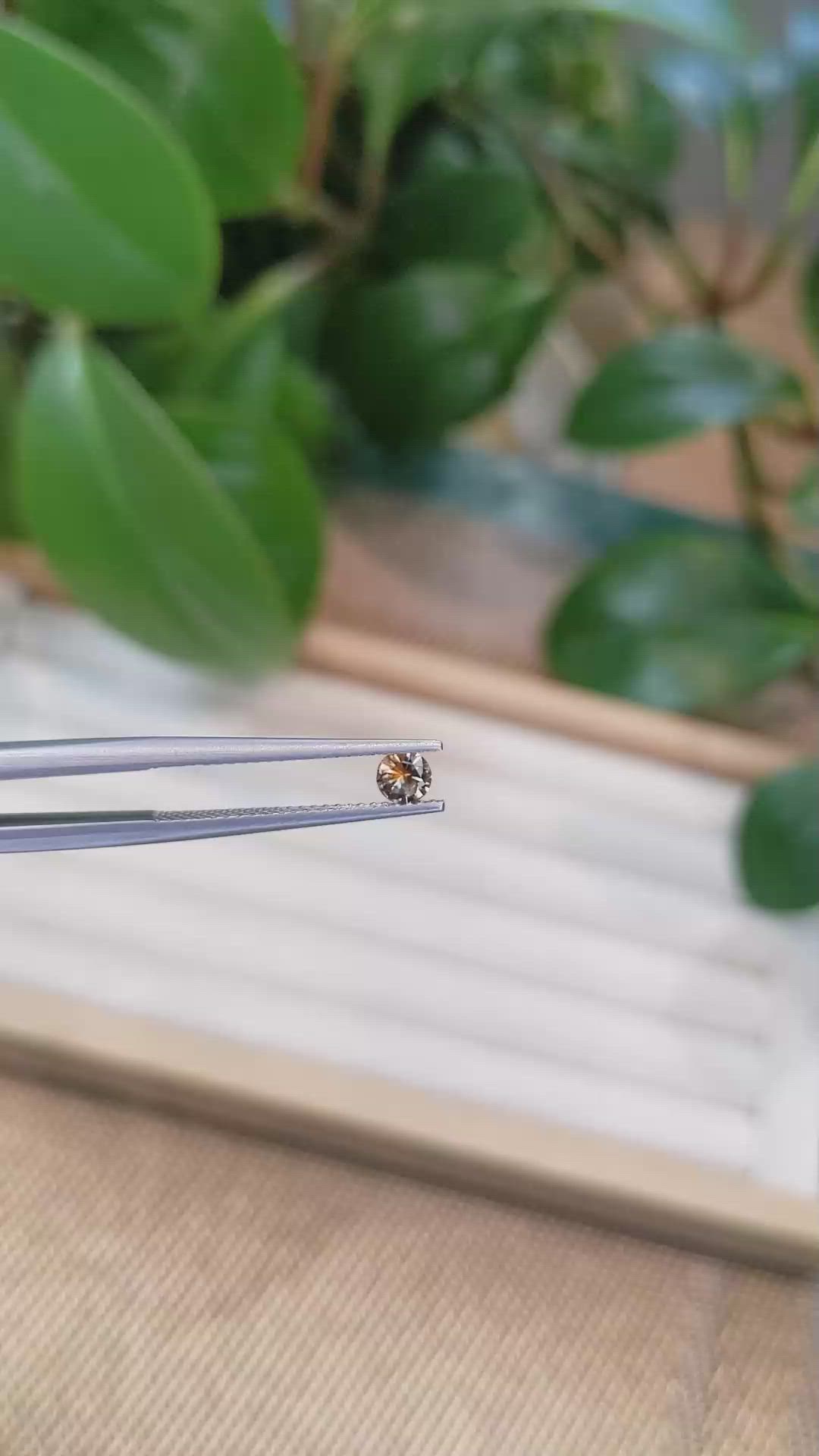 0.26 Ct. Yellowish Orange Sapphire from Montana Size Video