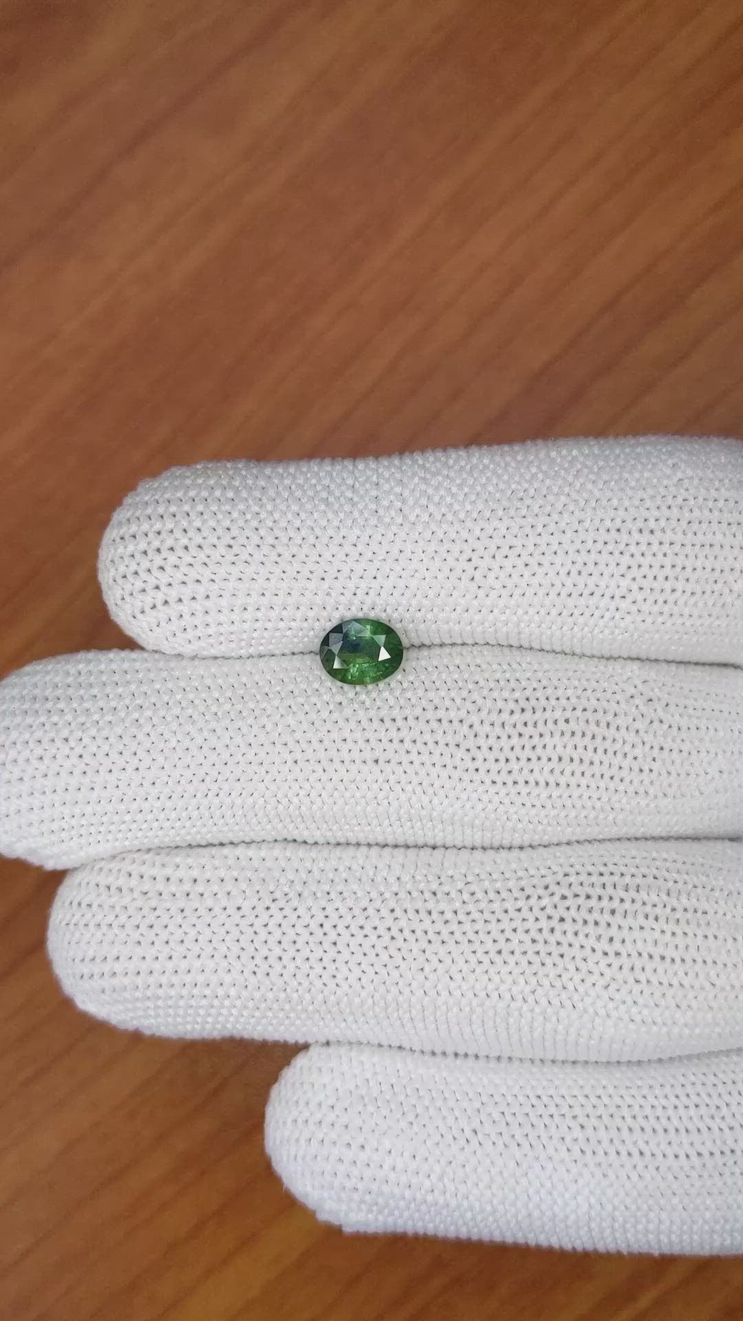 0.88 Ct. Bluish Green Sapphire from Madagascar Size Video