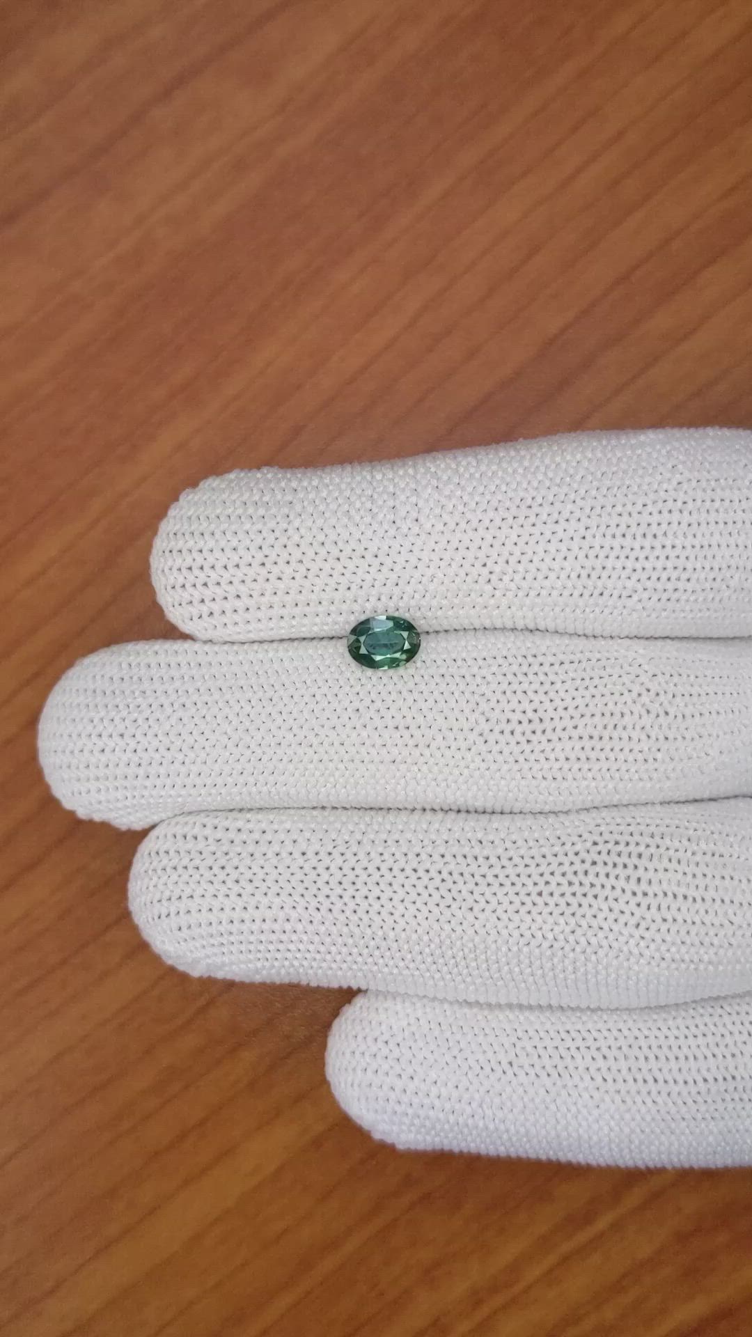 0.71 Ct. Bluish Green Sapphire from Madagascar Size Video
