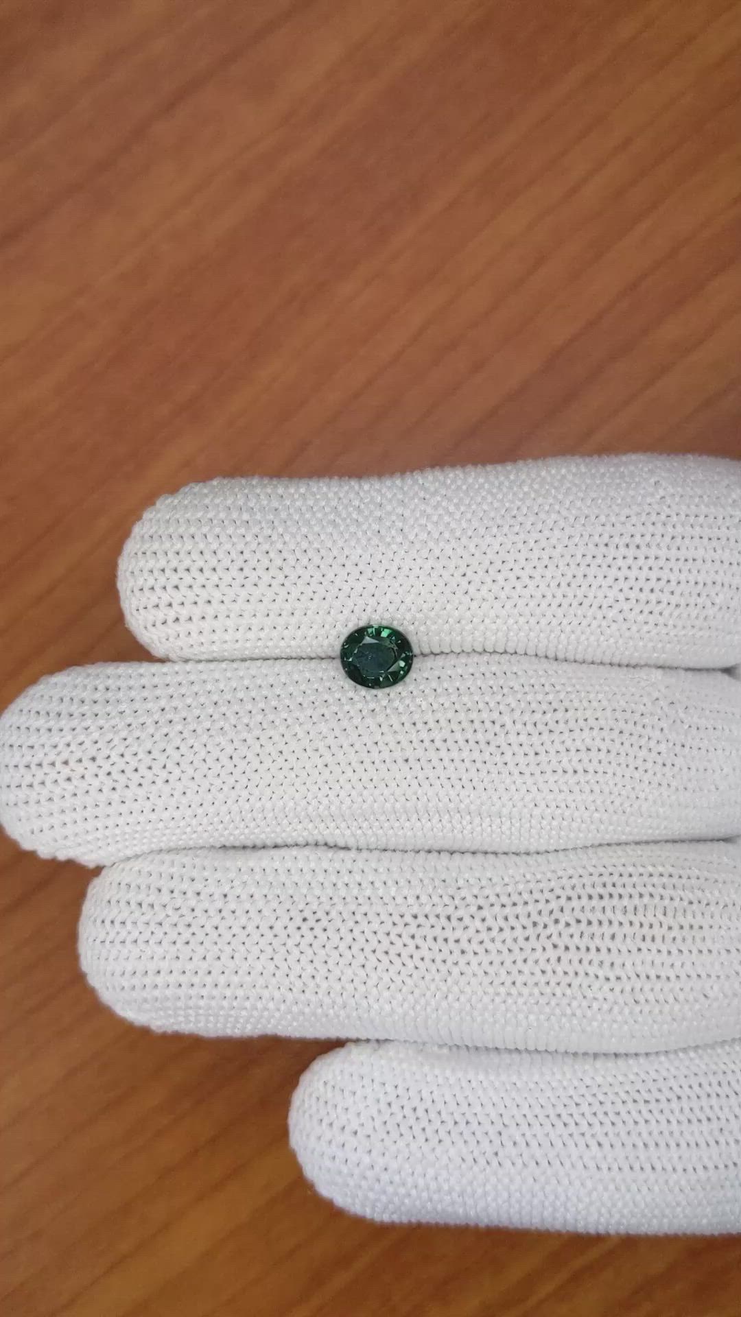 0.97 Ct. Bluish Green Sapphire from Madagascar Size Video