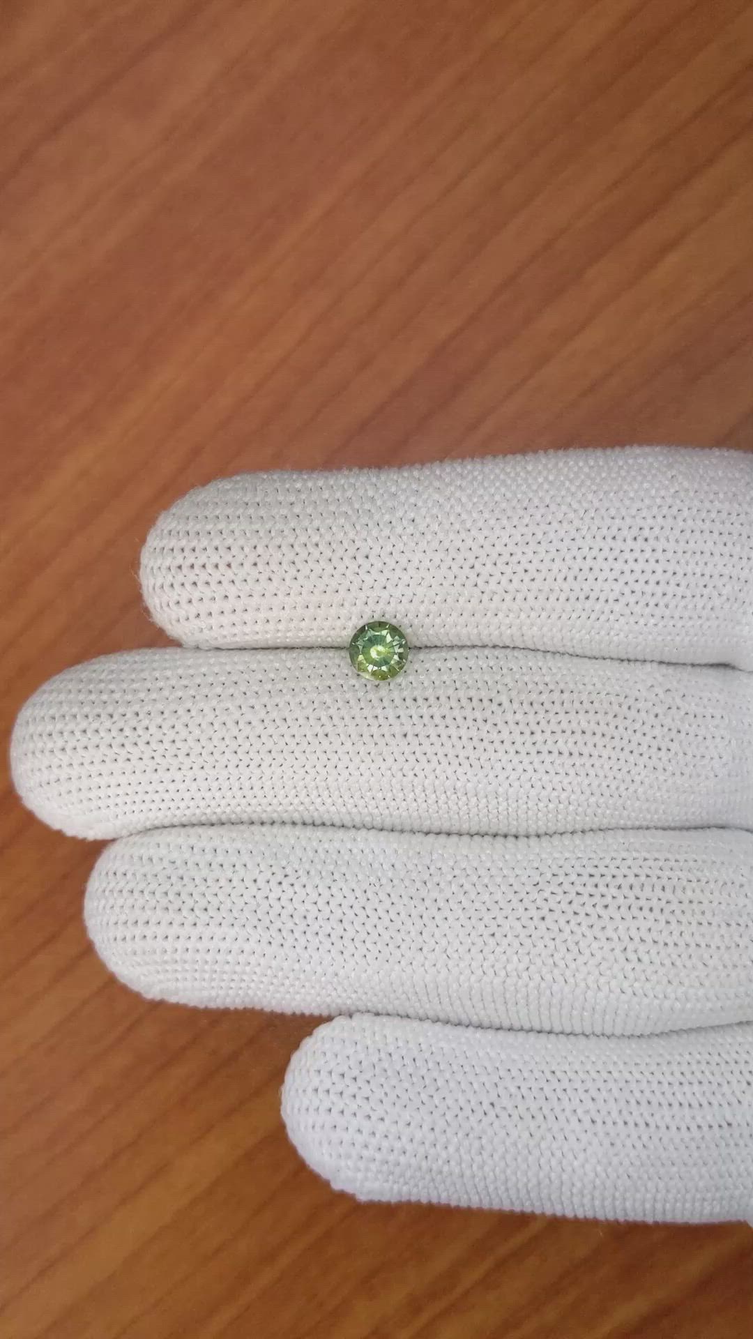 0.71 Ct. Yellowish Green Sapphire from Madagascar Size Video