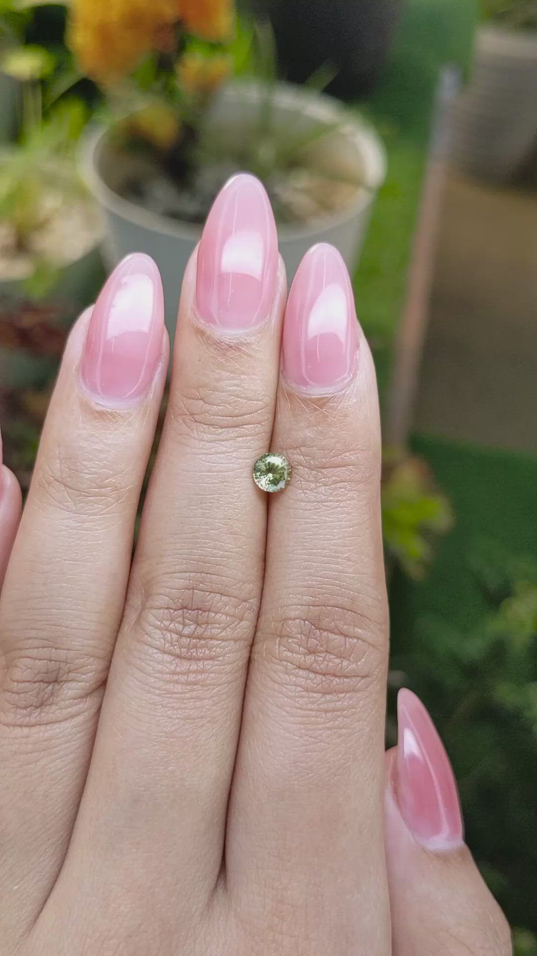 0.58 Ct. Yellowish Green Sapphire from Madagascar Size Video