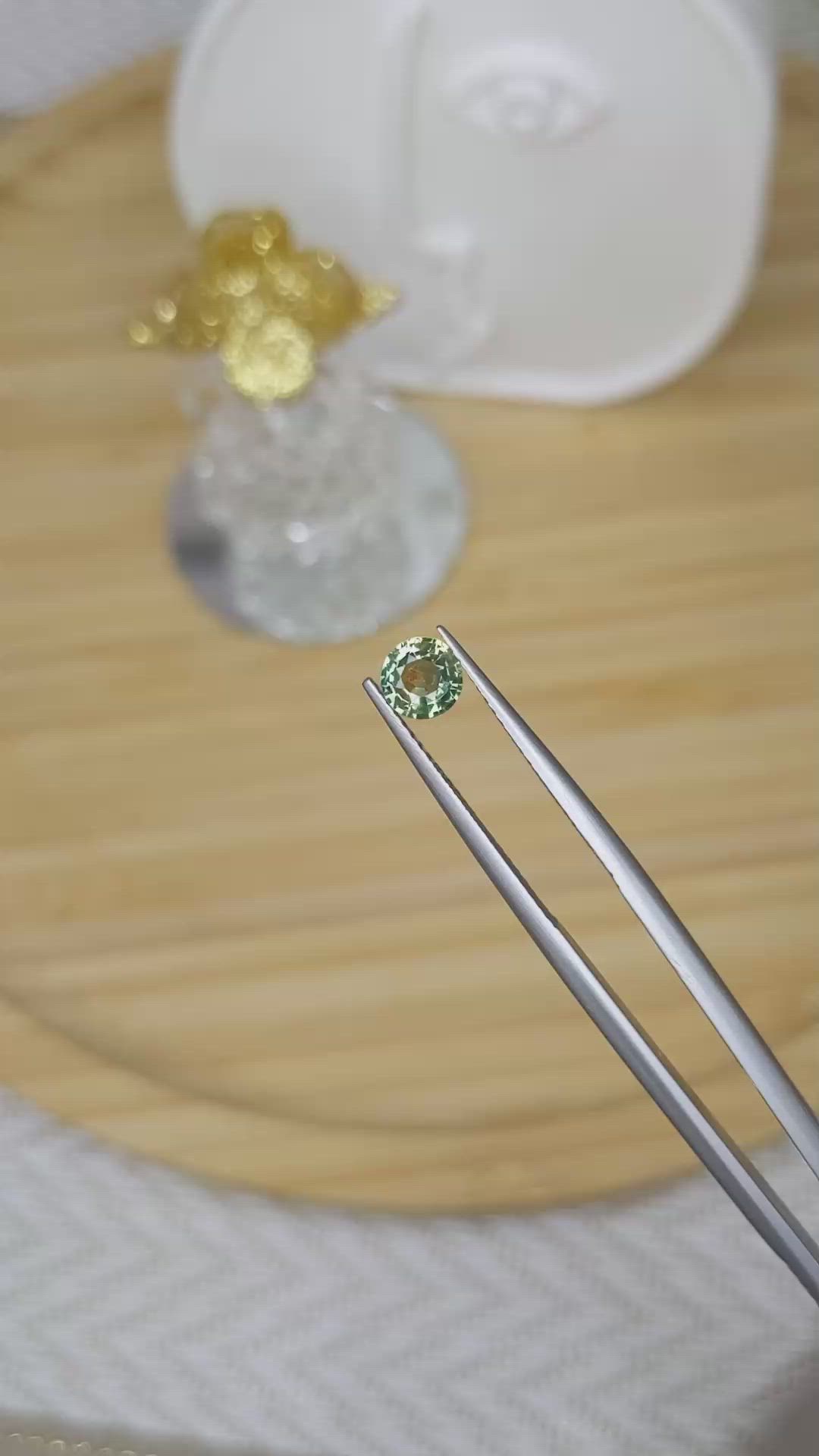 0.68 Ct. Yellowish Green Sapphire from Madagascar Size Video