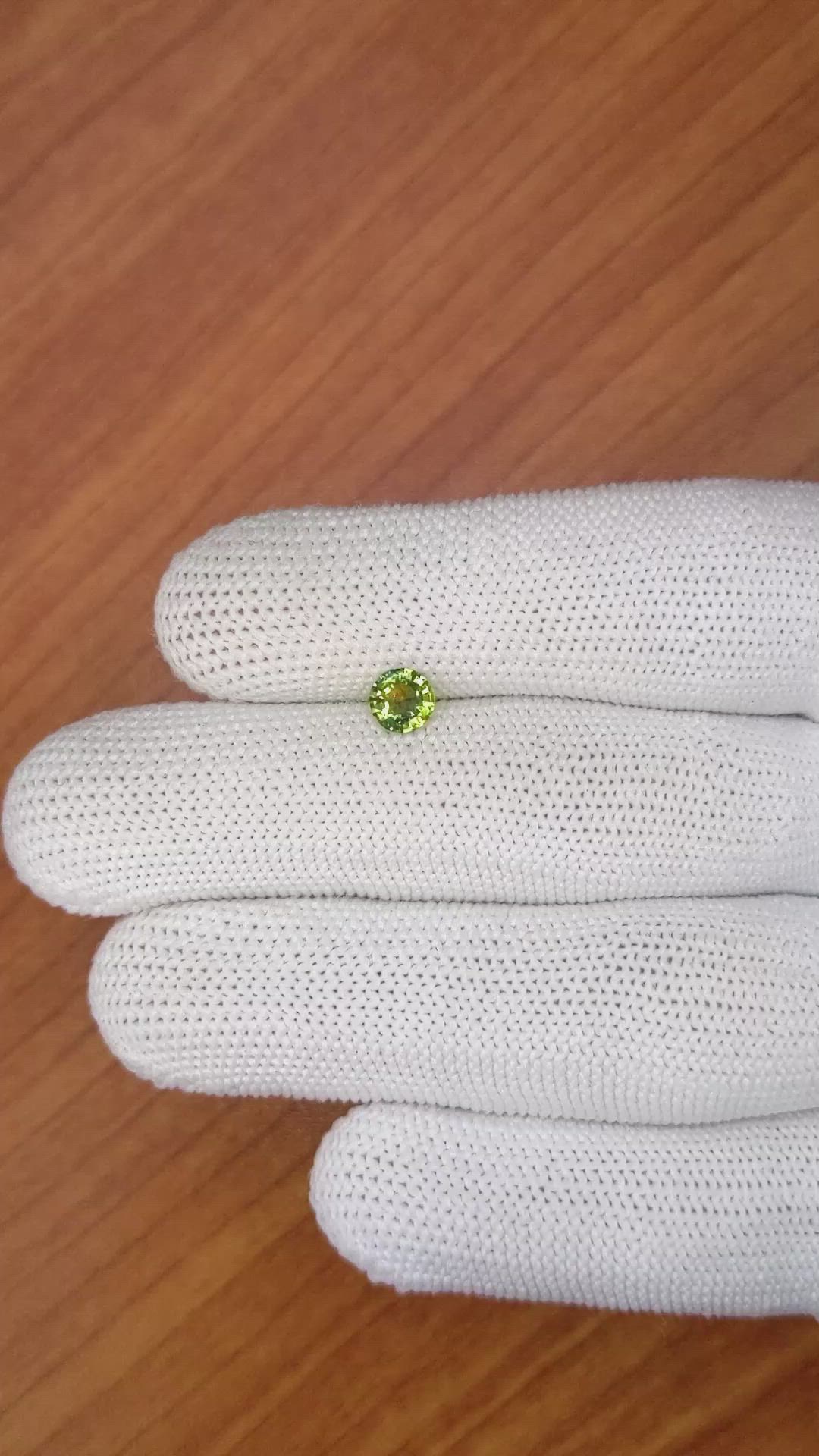 0.68 Ct. Yellowish Green Sapphire from Madagascar Size Video