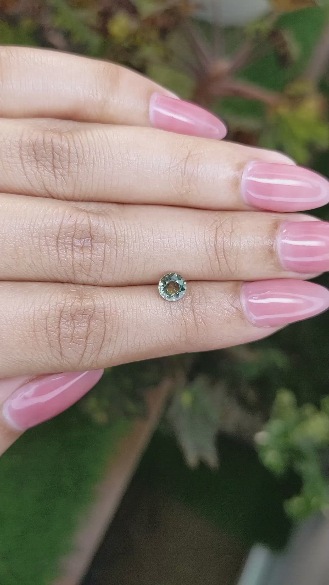 0.68 Ct. Yellowish Green Sapphire from Madagascar Size Video