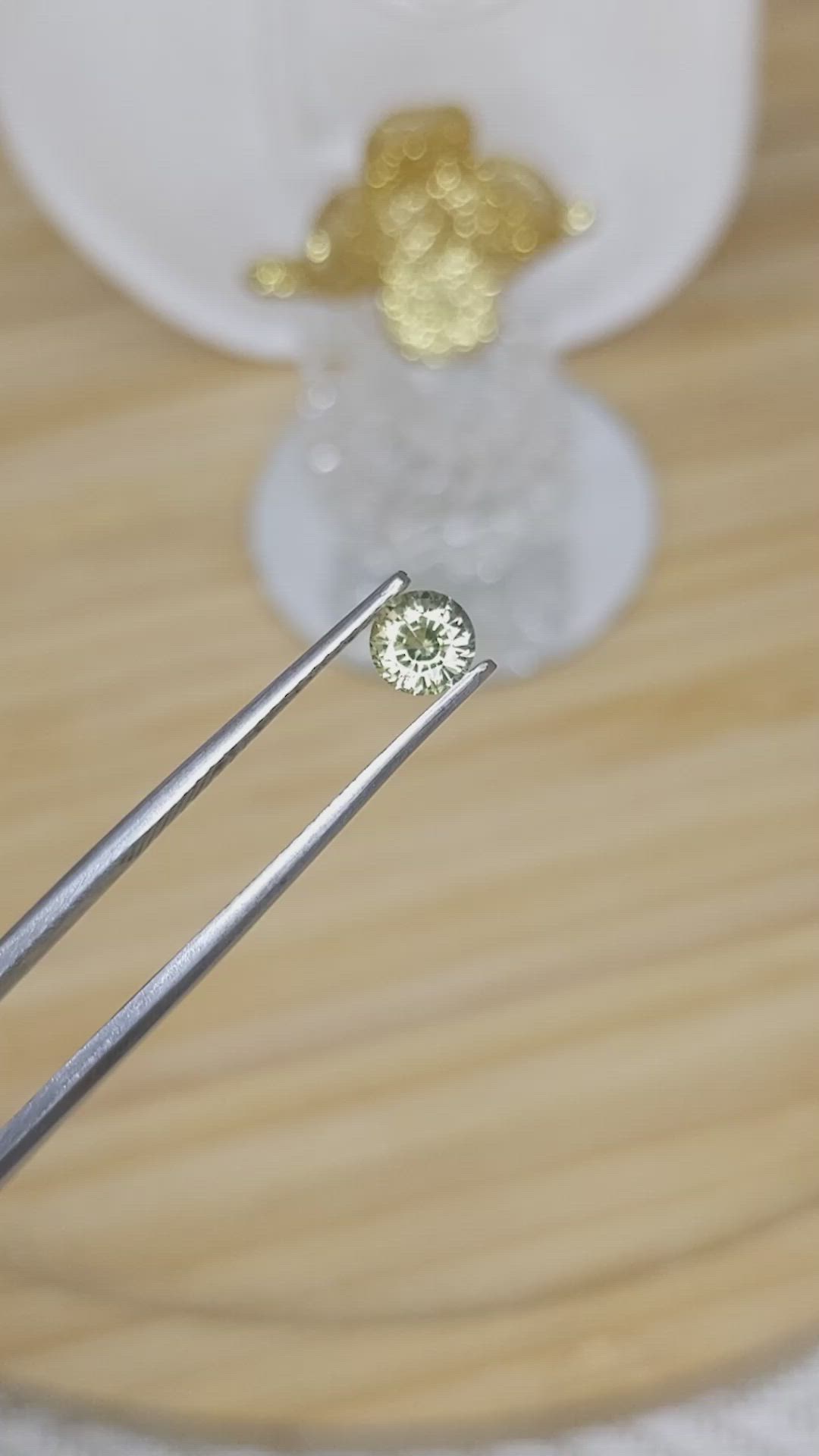 0.64 Ct. Greenish Yellow Sapphire from Madagascar Size Video