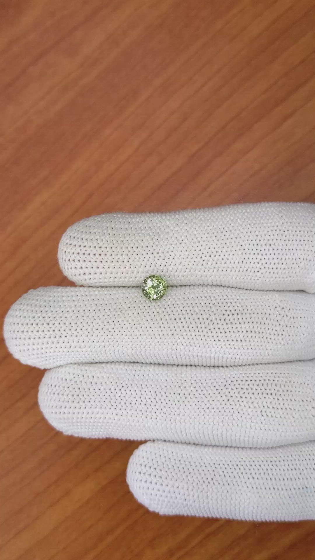 0.88 Ct. Yellowish Green Sapphire from Madagascar Size Video