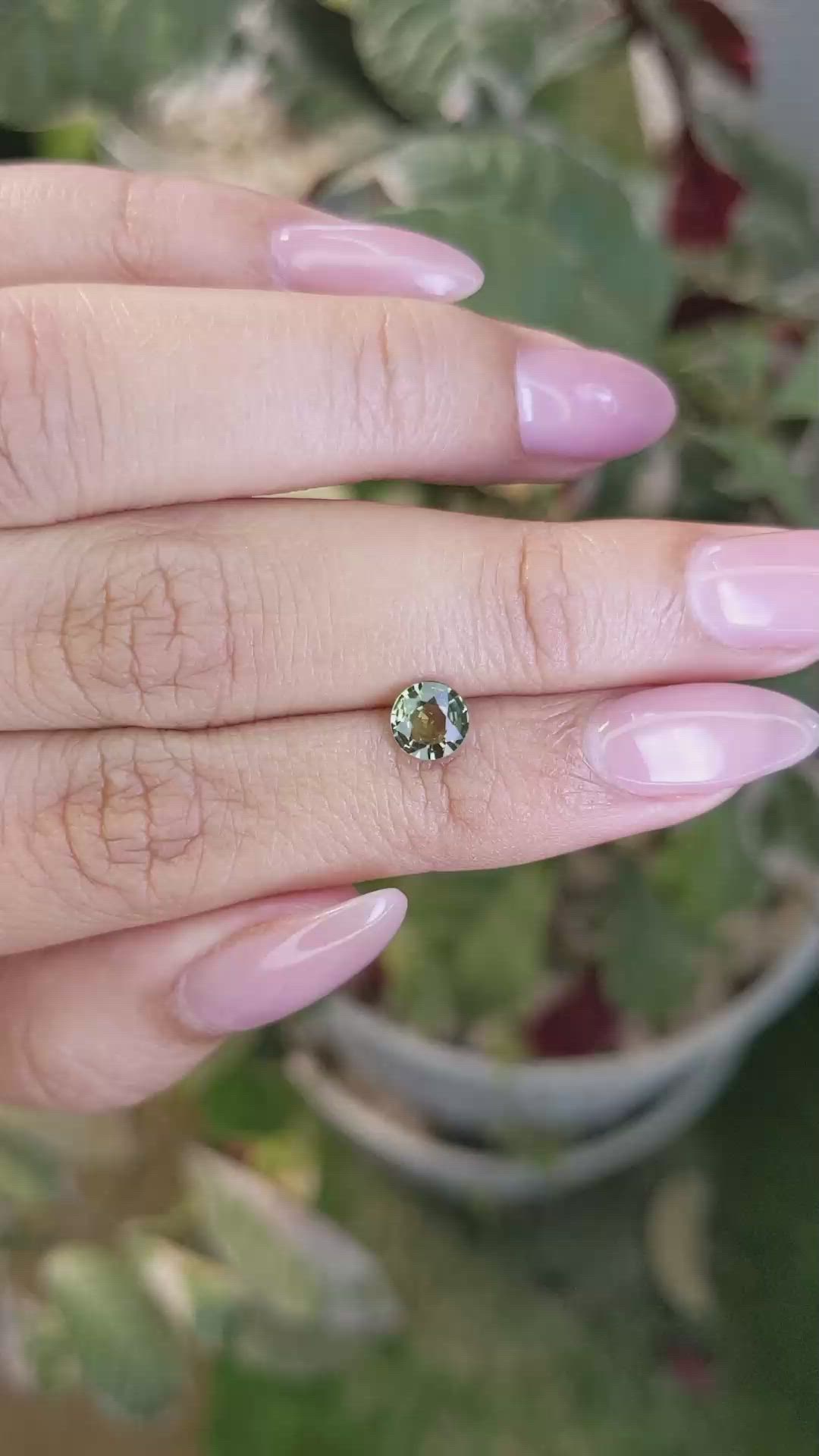 0.87 Ct. Yellowish Green Sapphire from Madagascar Size Video