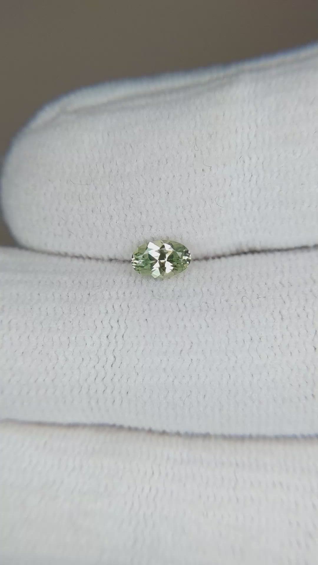 0.39 Ct. Yellowish Green Sapphire from Montana Size Video