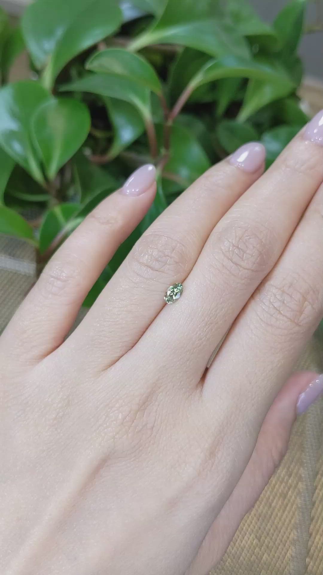 0.39 Ct. Yellowish Green Sapphire from Montana Size Video