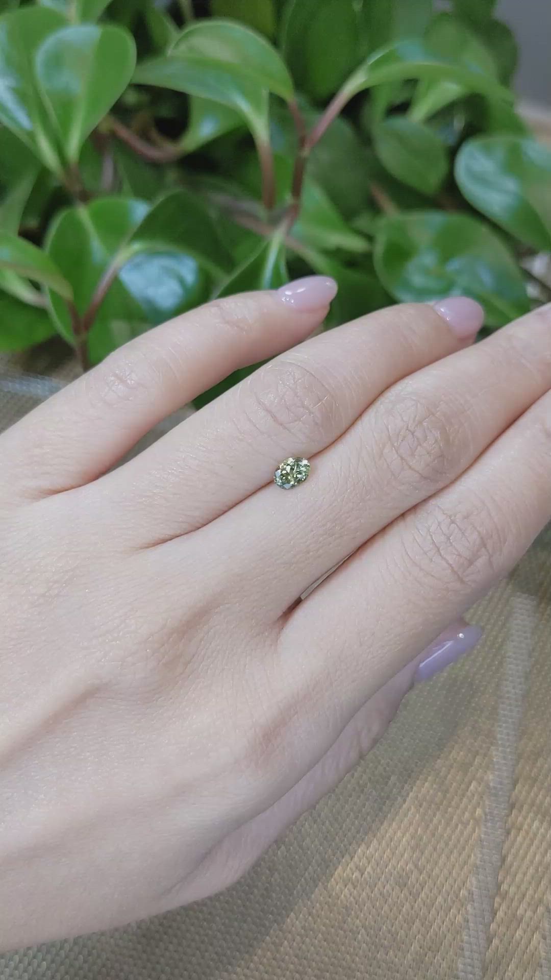 0.46 Ct. Yellowish Green Sapphire from Montana Size Video