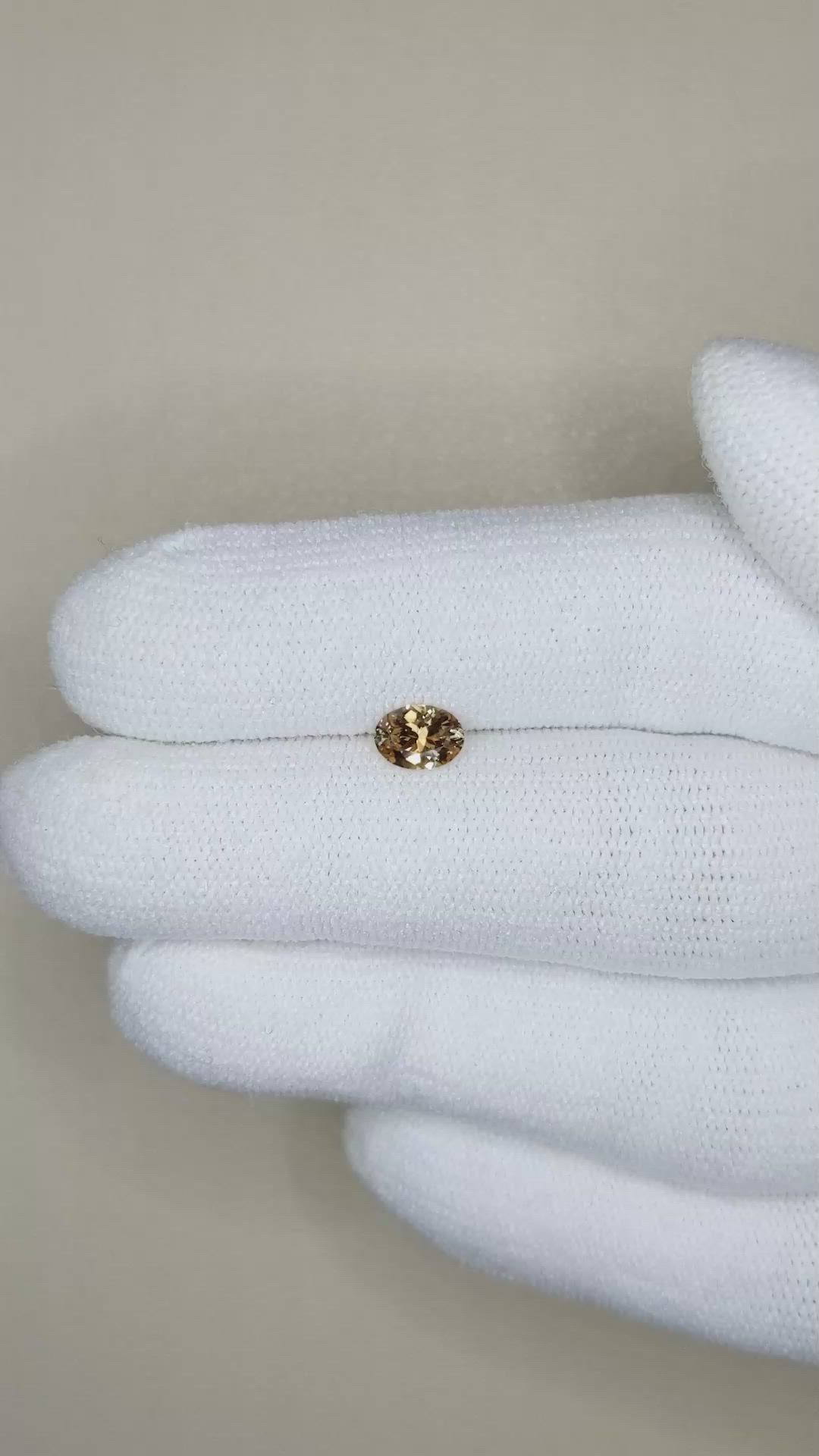 0.48 Ct. Yellowish Brown Sapphire from Montana Size Video