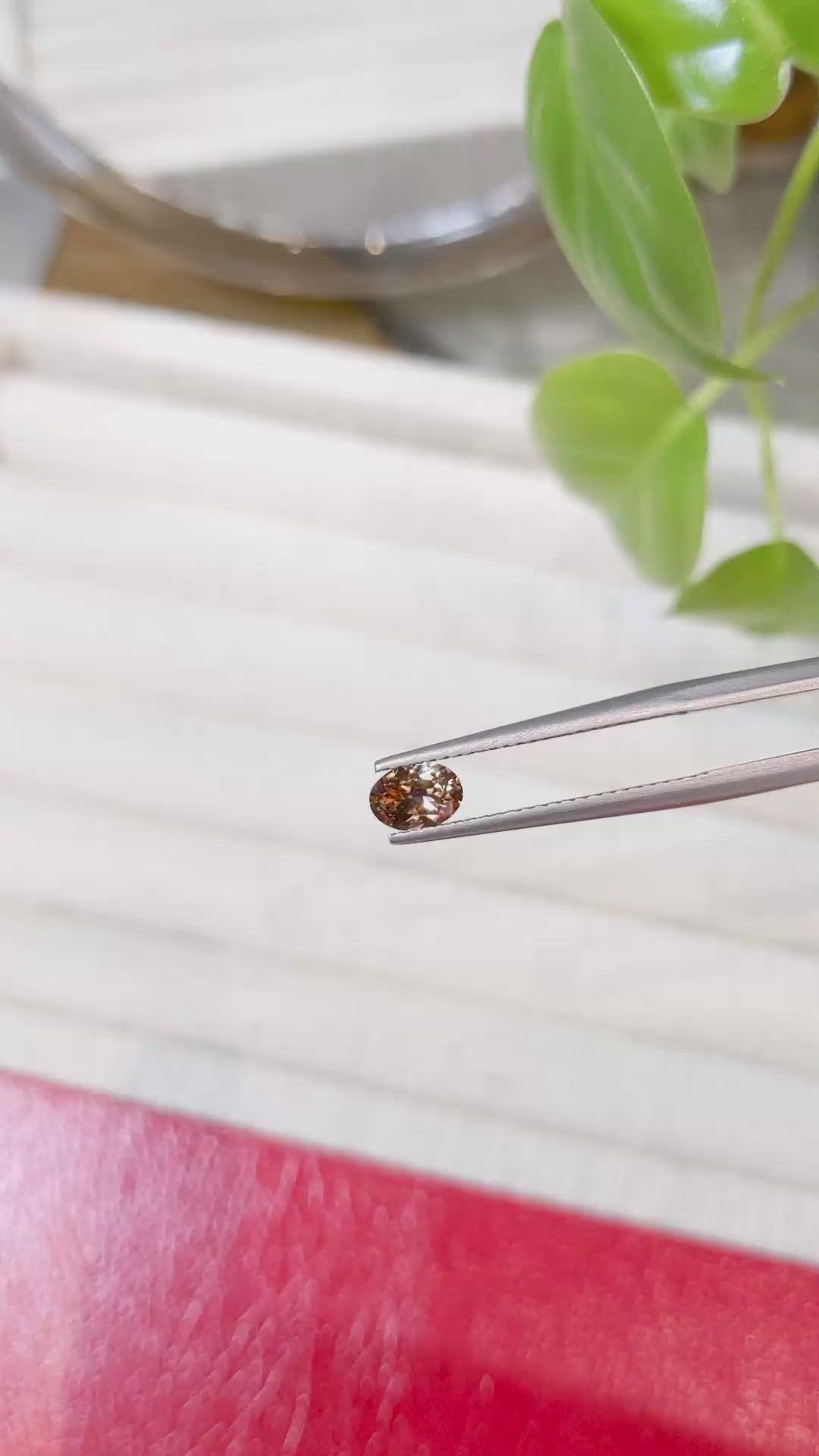 0.49 Ct. Orangish Brown Sapphire from Montana Size Video