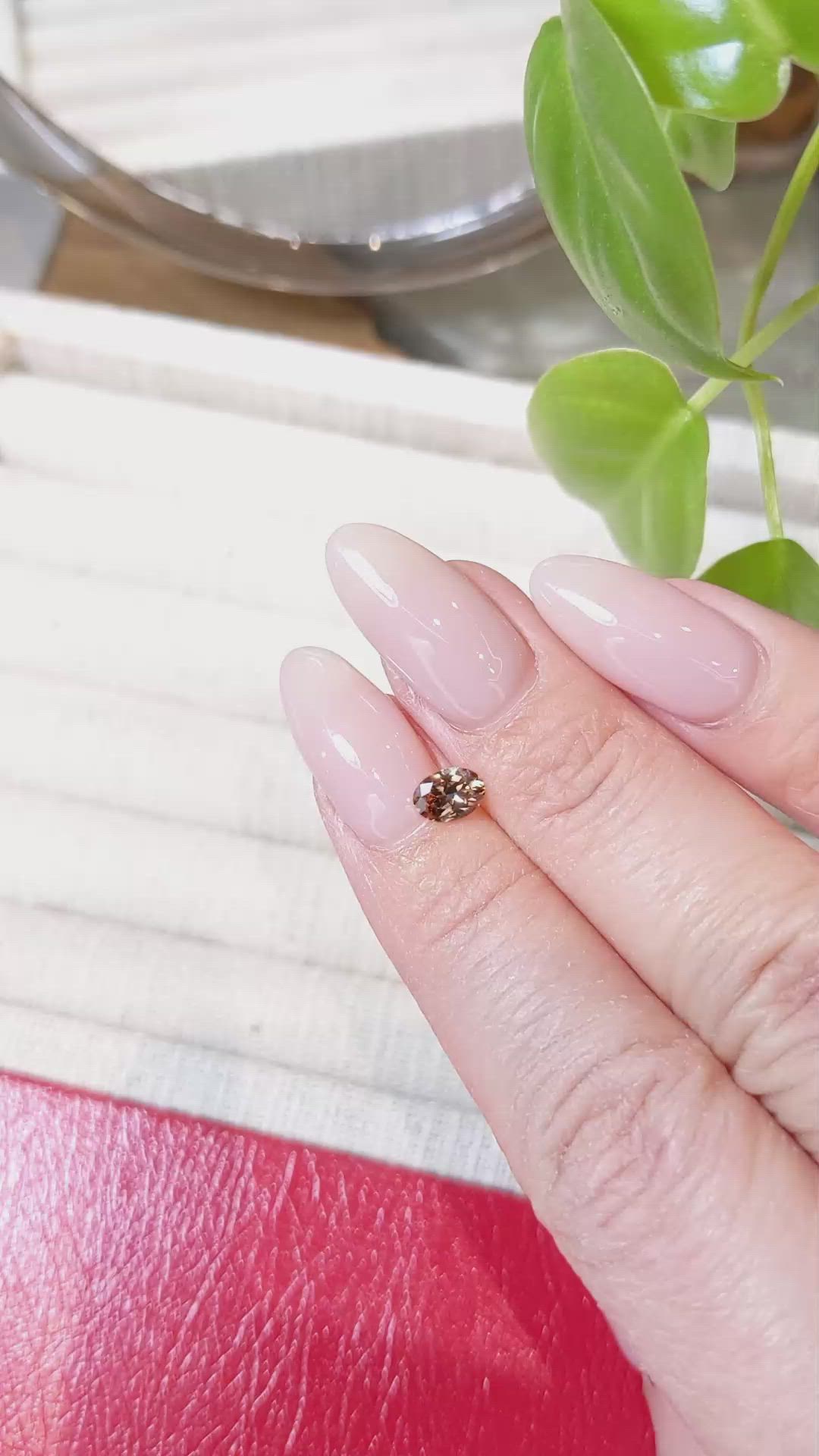 0.49 Ct. Orangish Brown Sapphire from Montana Size Video