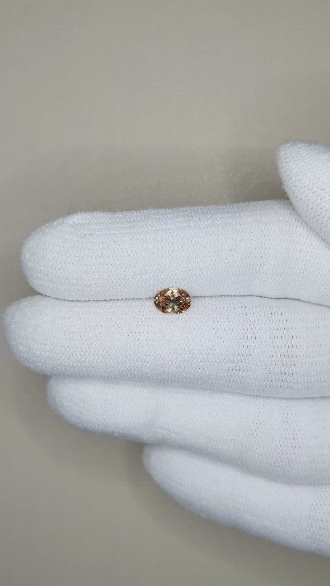 0.49 Ct. Orangish Brown Sapphire from Montana Size Video