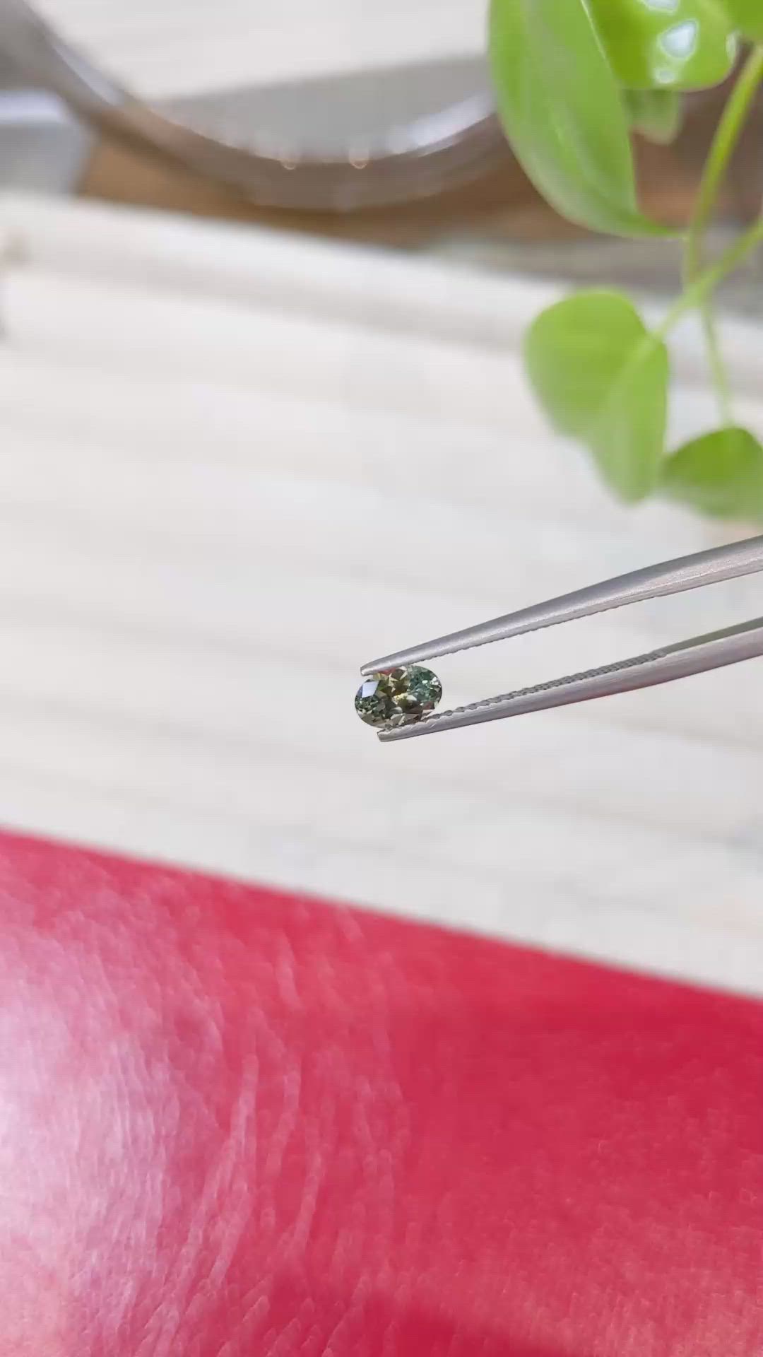 0.57 Ct. Yellowish Green Sapphire from Montana Size Video