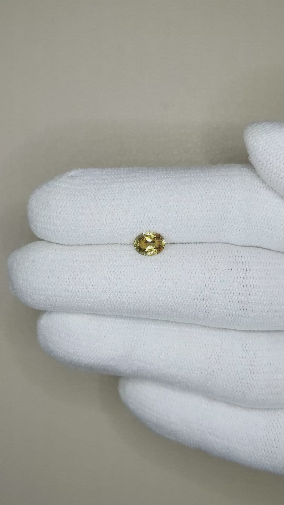 0.58 Ct. Greenish Yellow Sapphire from Montana Size Video