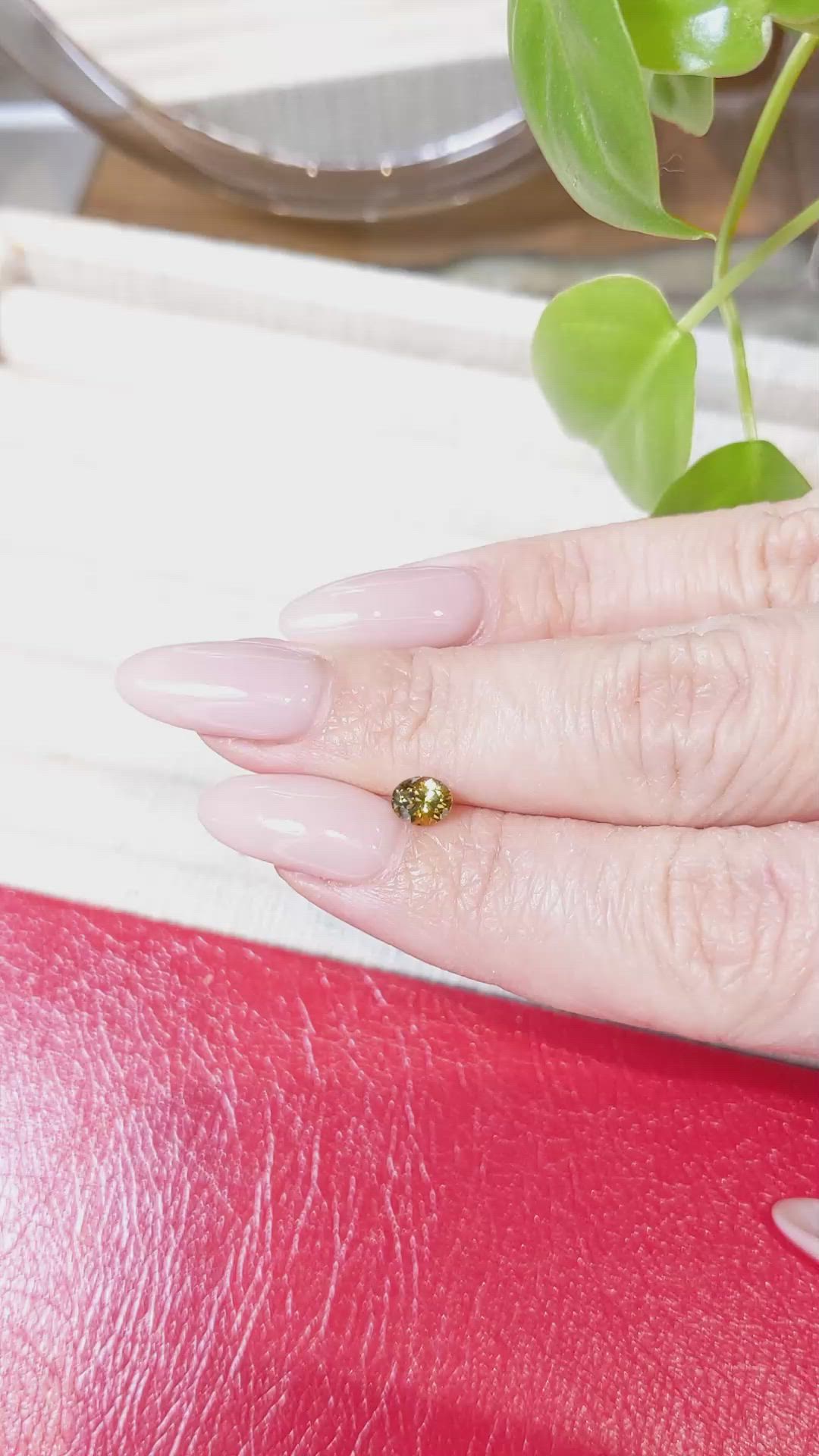 0.58 Ct. Greenish Yellow Sapphire from Montana Size Video