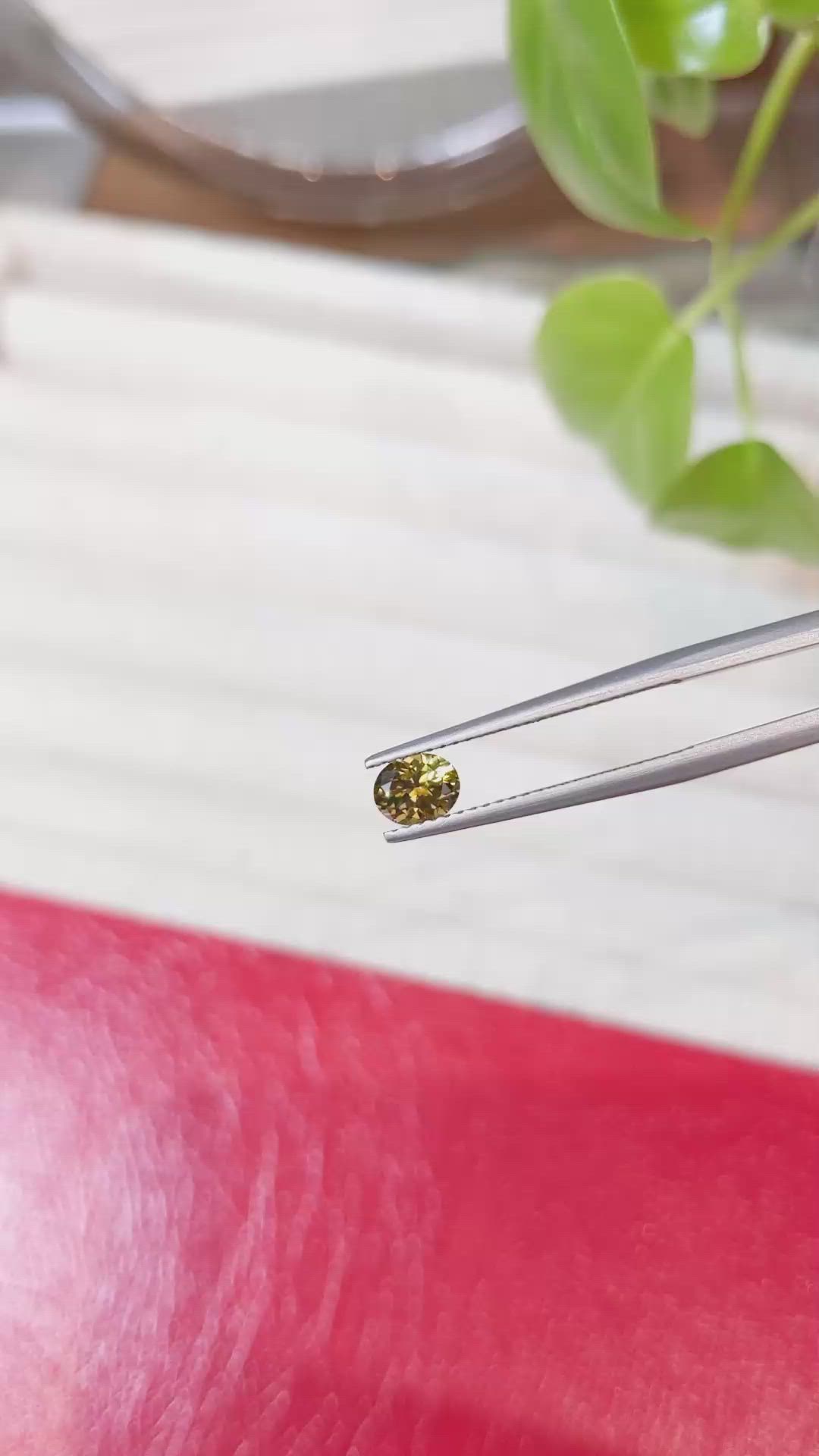 0.58 Ct. Greenish Yellow Sapphire from Montana Size Video