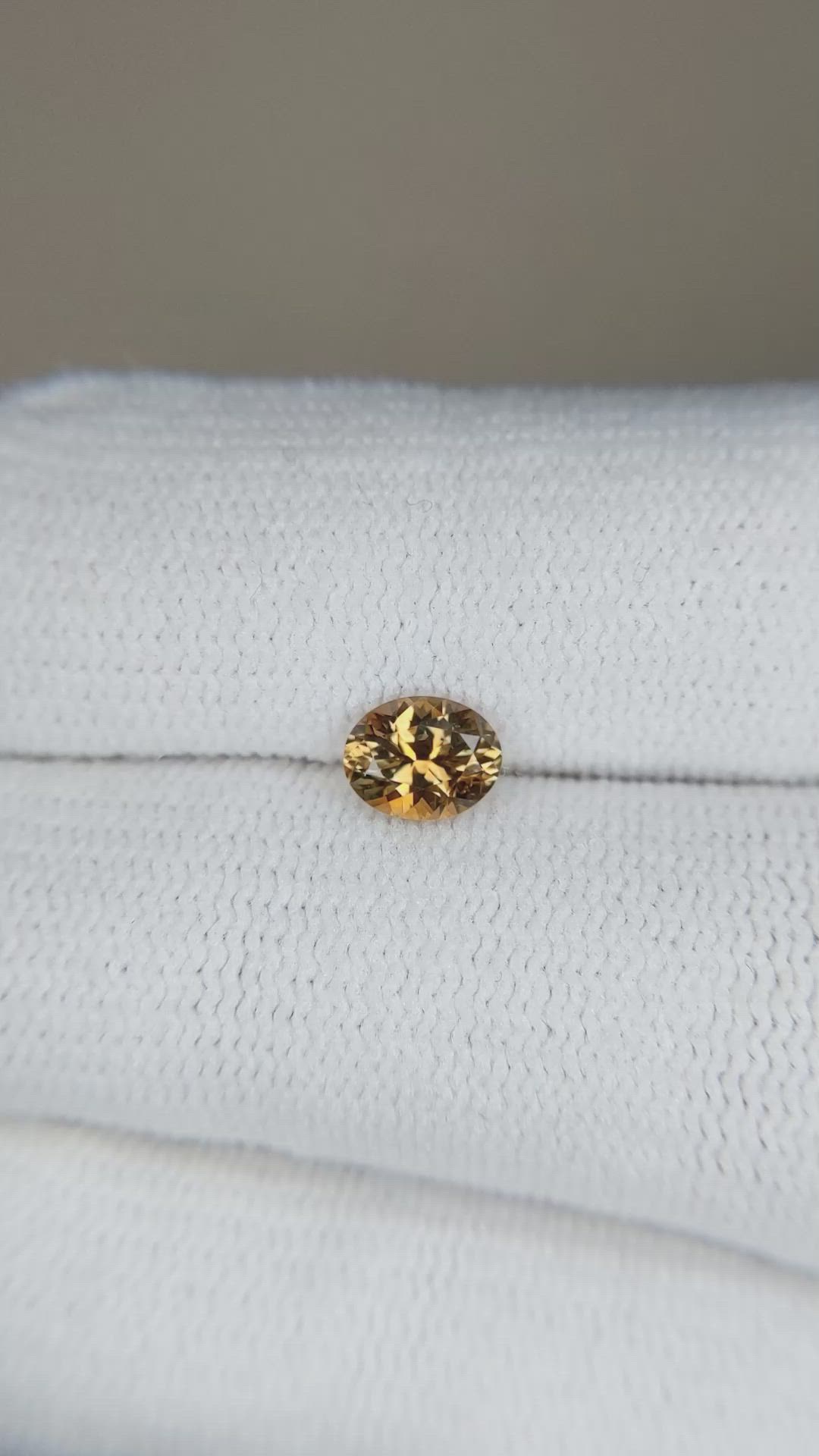 0.59 Ct. Yellowish Orange Sapphire from Montana Size Video