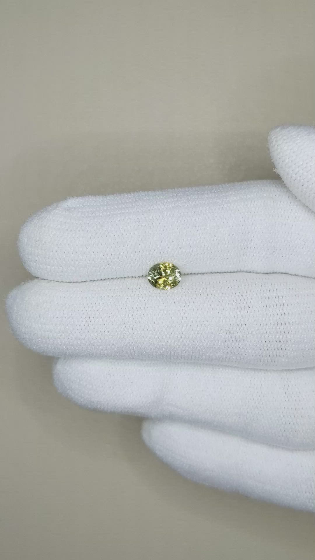 0.59 Ct. Greenish Yellow Sapphire from Montana Size Video