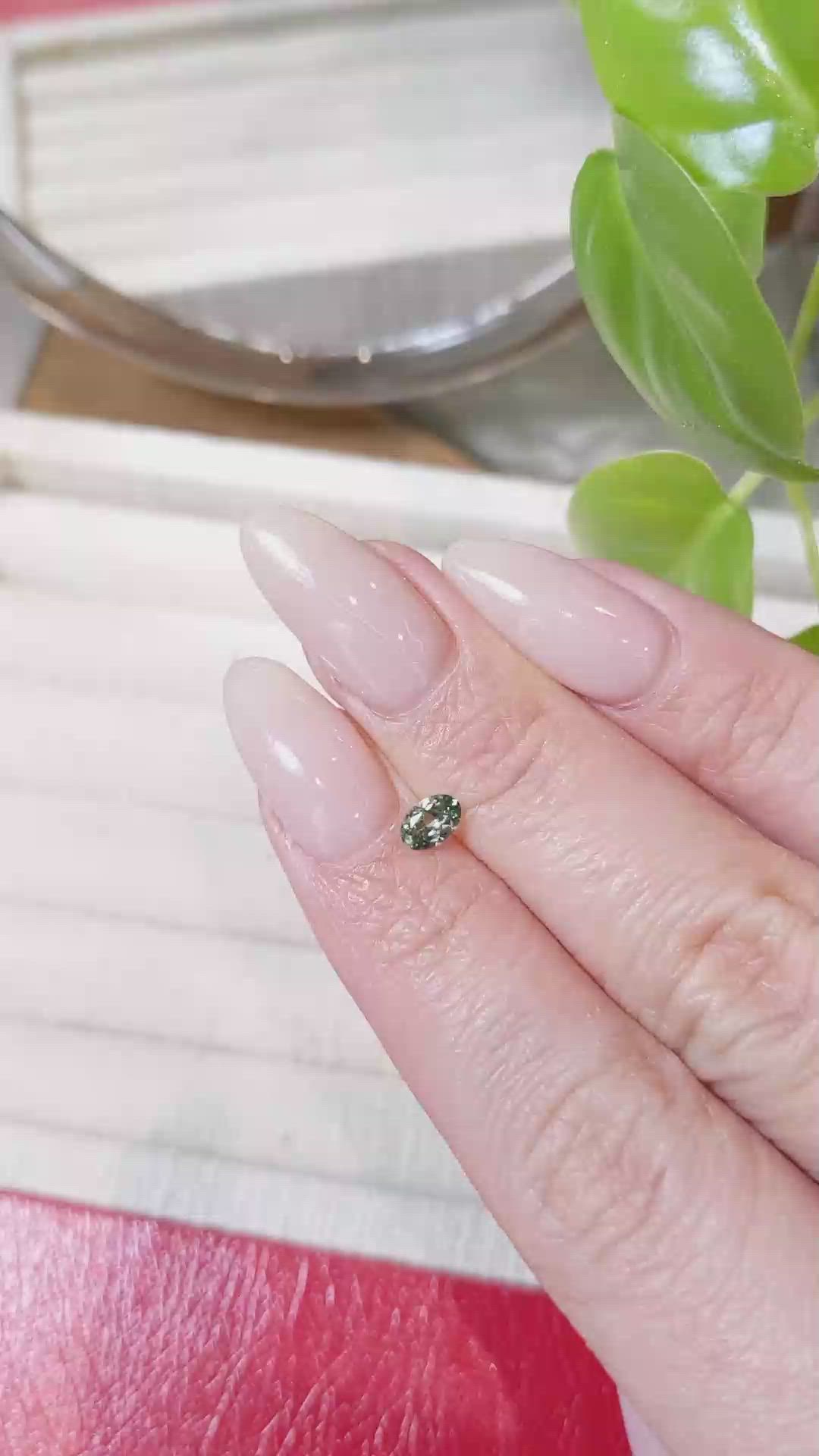 0.34 Ct. Yellowish Green Sapphire from Montana Size Video