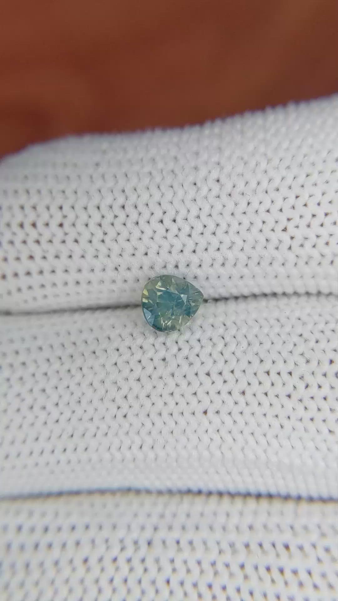 0.91 Ct. Bluish Green Sapphire from Madagascar Size Video