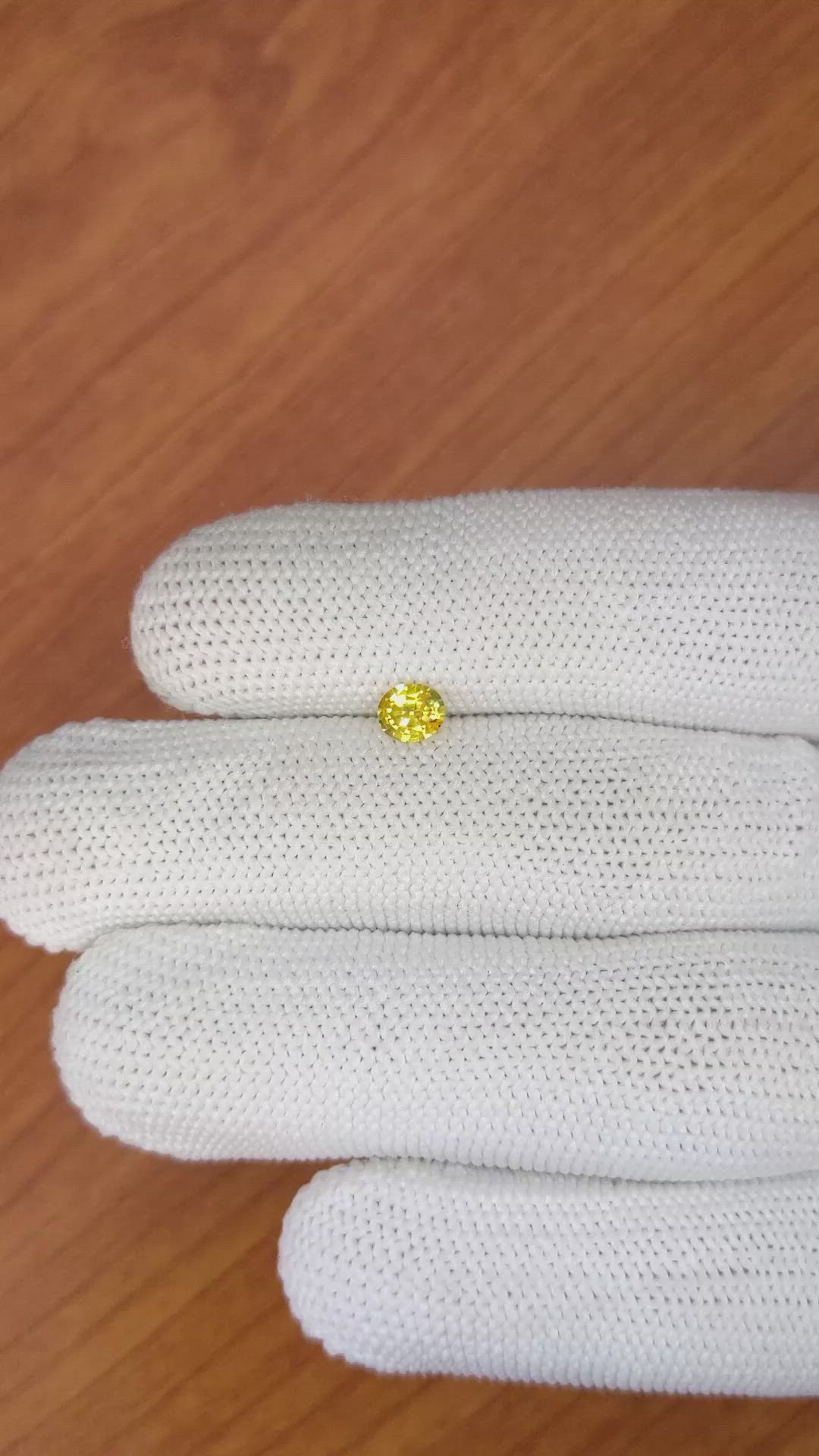 0.39 Ct. Orangish Yellow Sapphire from Ceylon (Sri Lanka) Size Video