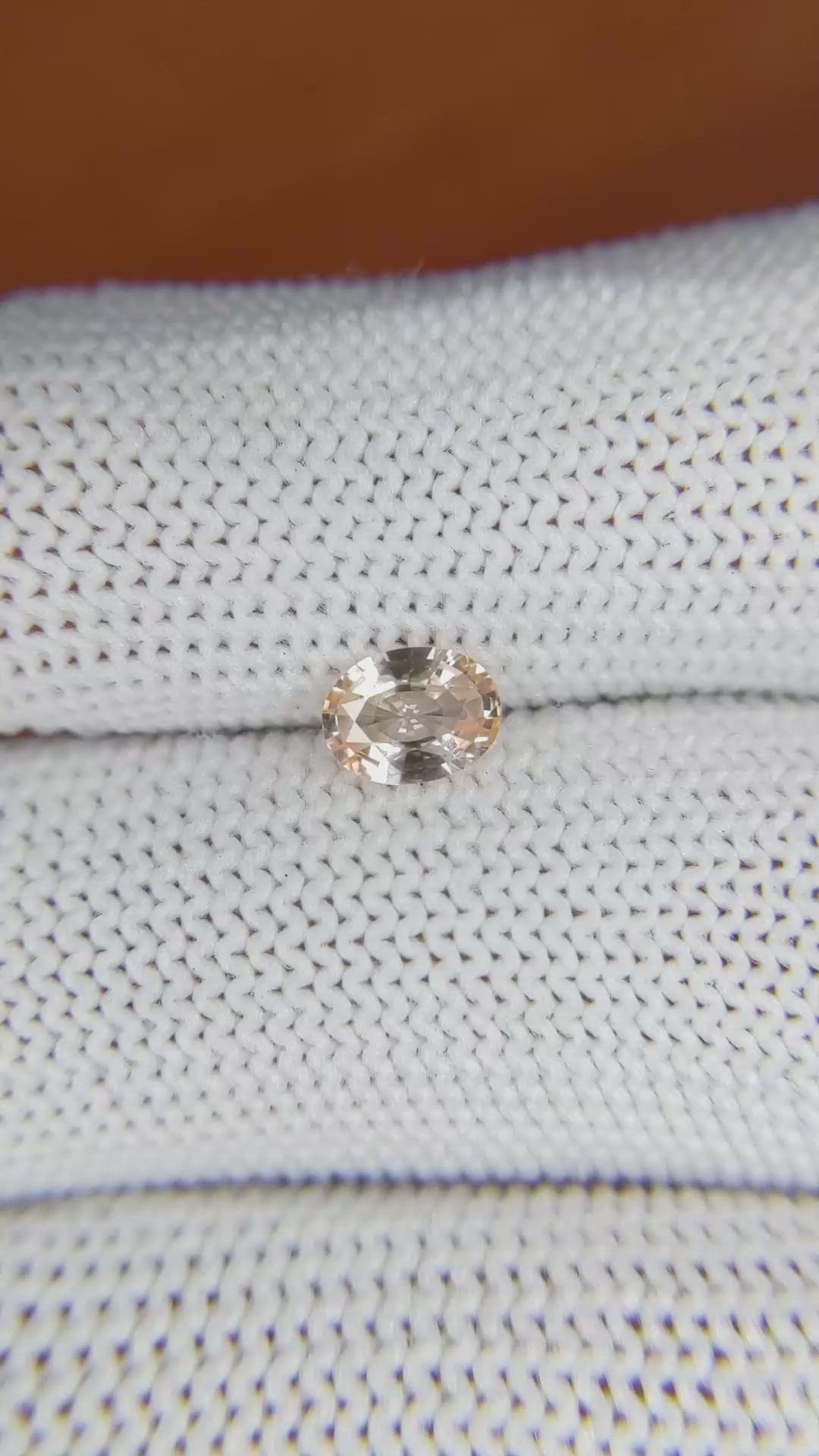 0.59 Ct. Peach Sapphire from Ceylon (Sri Lanka) Size Video