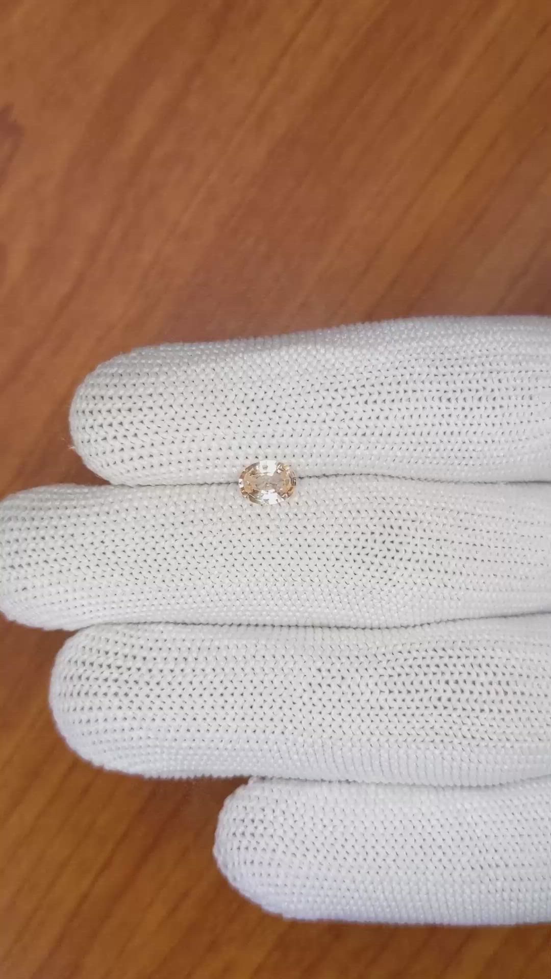 0.59 Ct. Peach Sapphire from Ceylon (Sri Lanka) Size Video