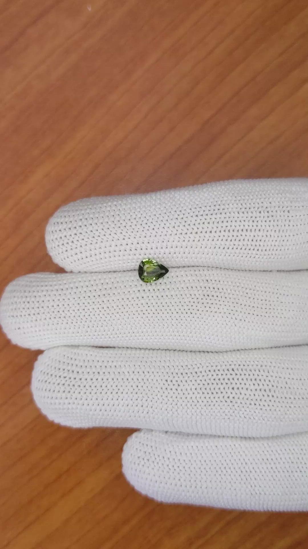 0.60 Ct. Yellowish Green Sapphire from Madagascar Size Video