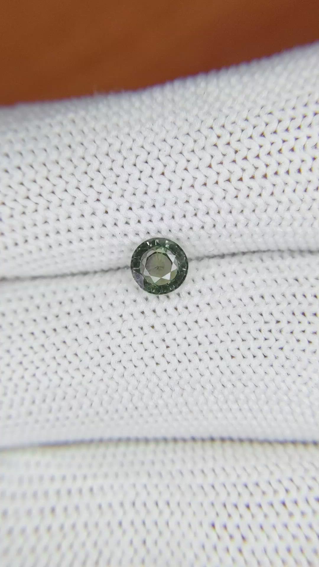 0.73 Ct. Brownish Green Sapphire from Madagascar Size Video