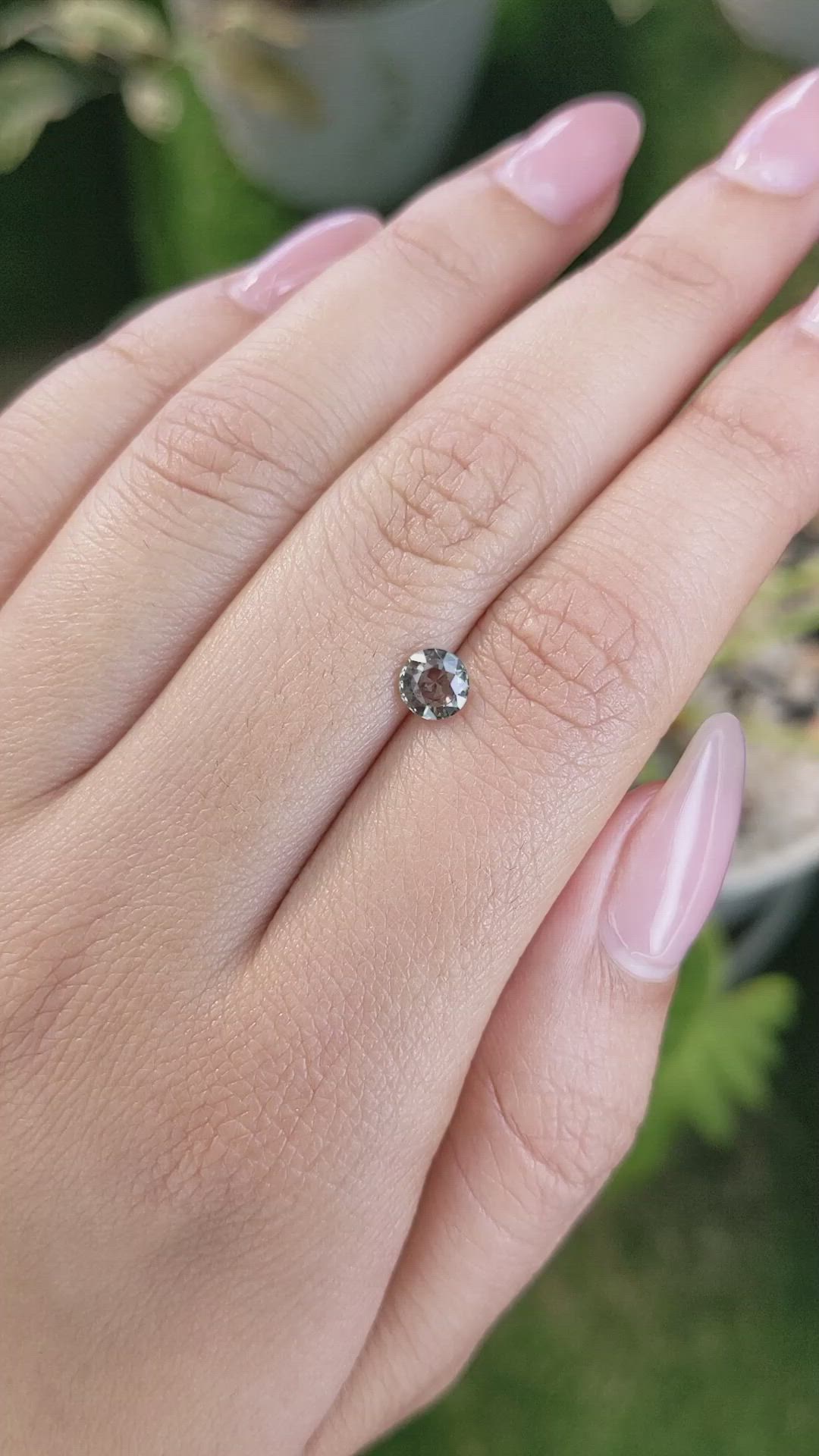 0.73 Ct. Brownish Green Sapphire from Madagascar Size Video