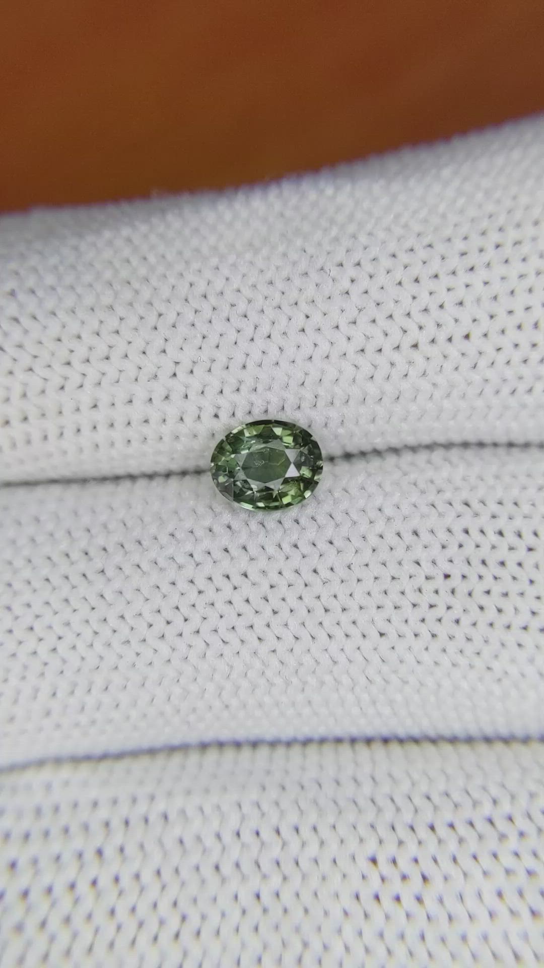 0.84 Ct. Brownish Green Sapphire from Madagascar Size Video