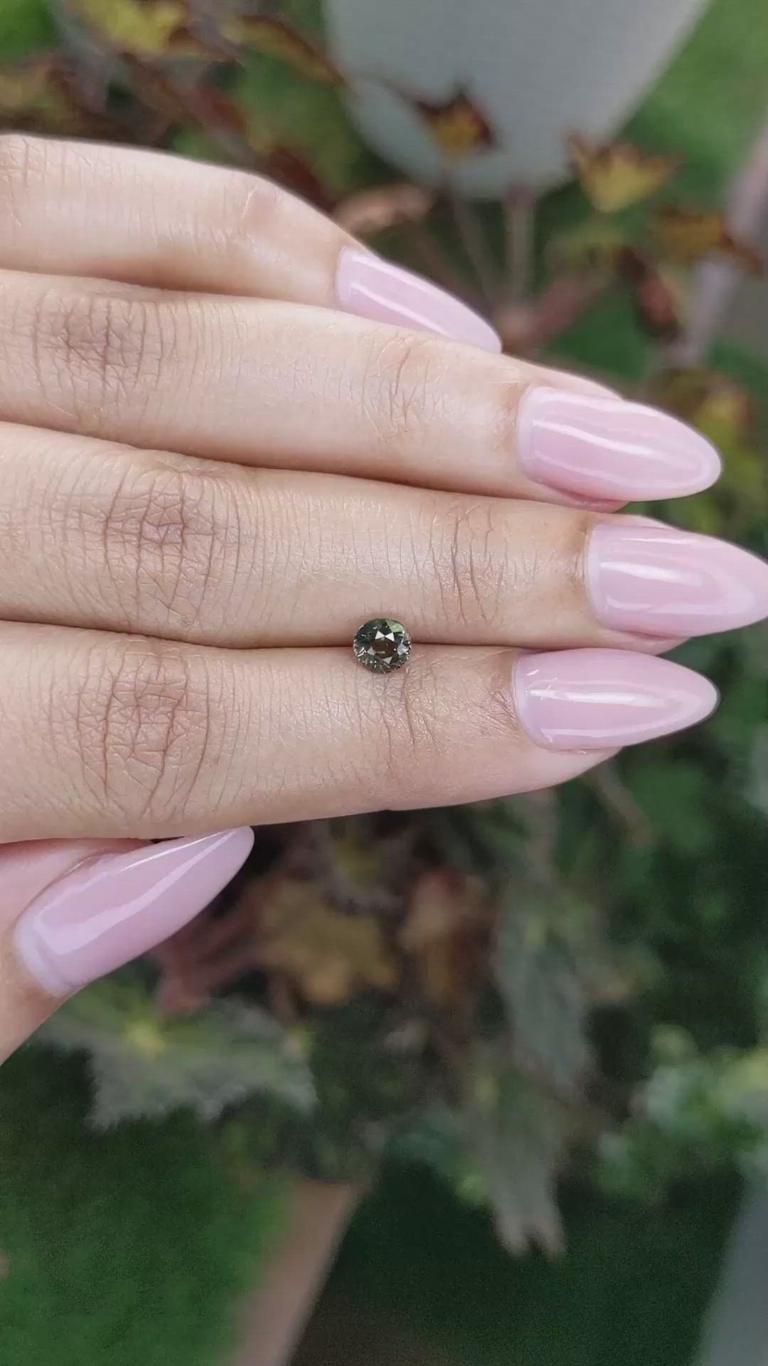 0.61 Ct. Brownish Green Sapphire from Madagascar Size Video