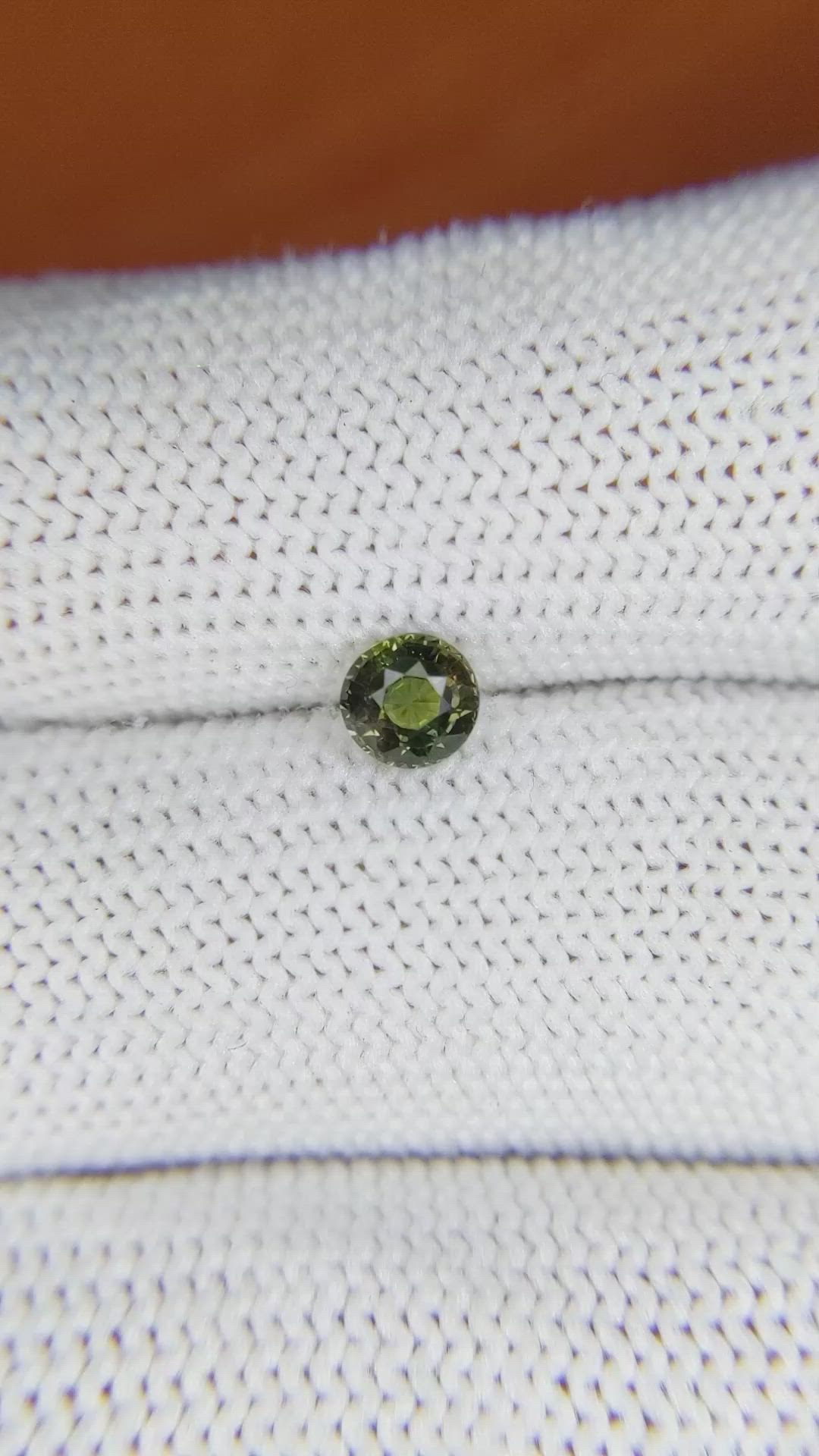 0.61 Ct. Brownish Green Sapphire from Madagascar Size Video