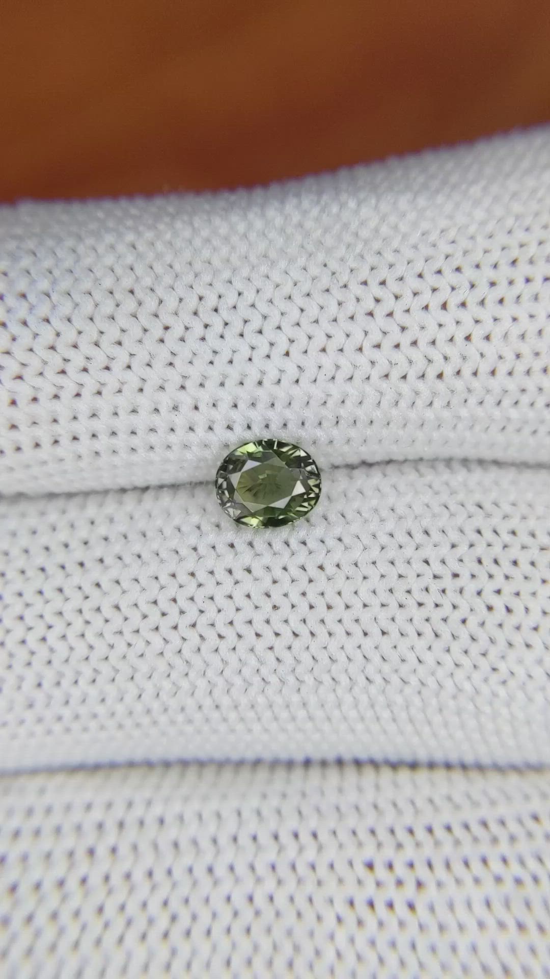 0.83 Ct. Yellowish Green Sapphire from Madagascar Size Video