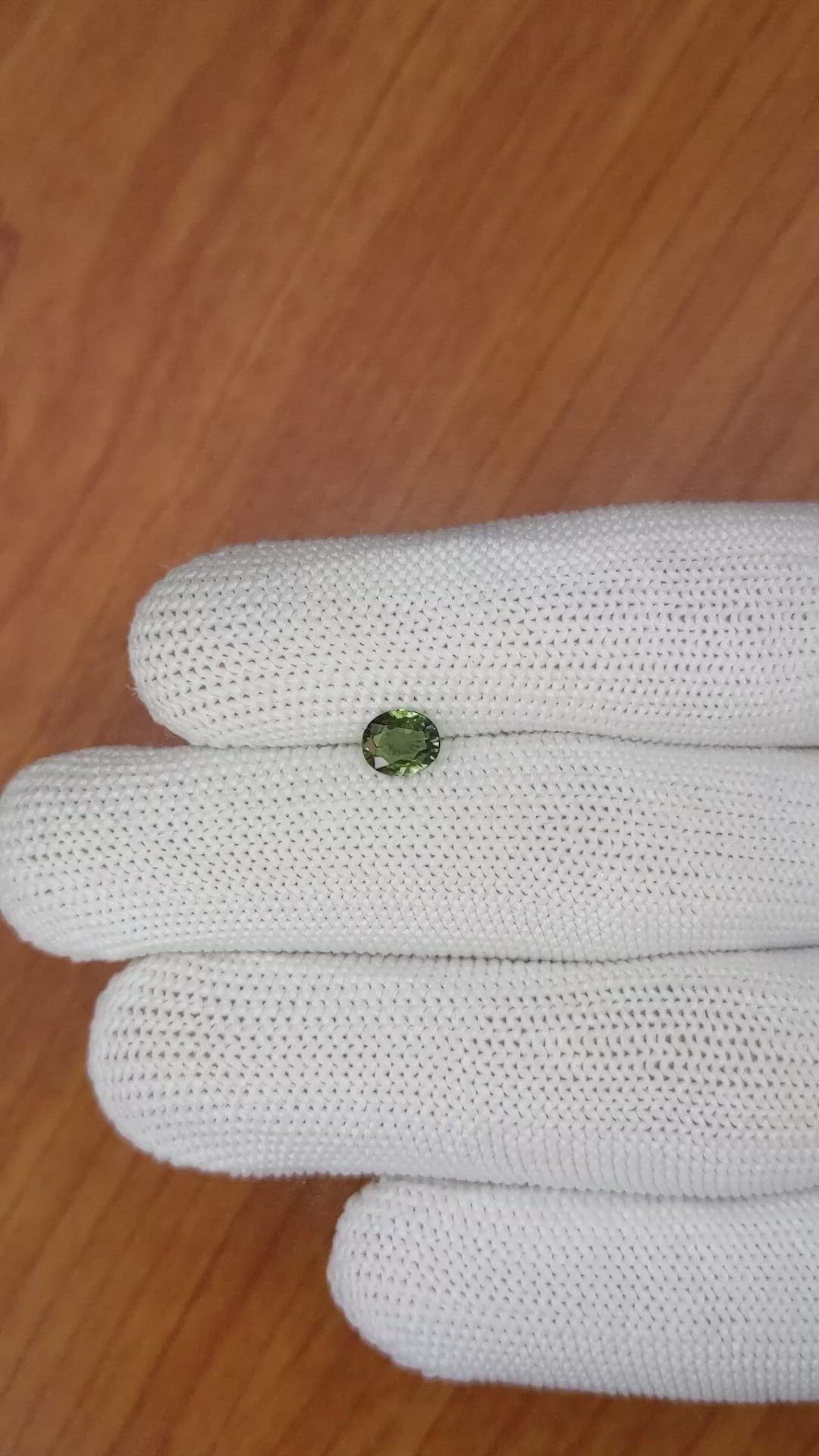 0.83 Ct. Yellowish Green Sapphire from Madagascar Size Video