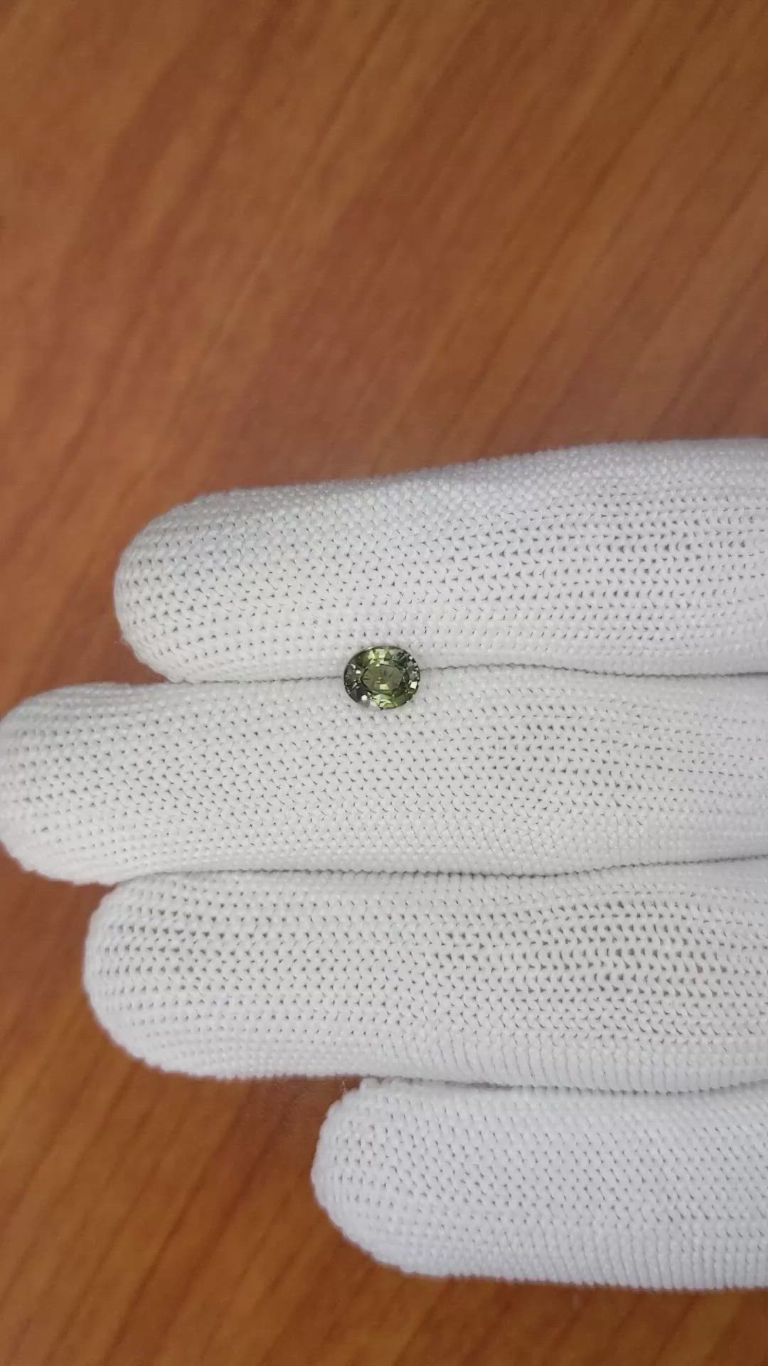 0.88 Ct. Yellowish Green Sapphire from Madagascar Size Video