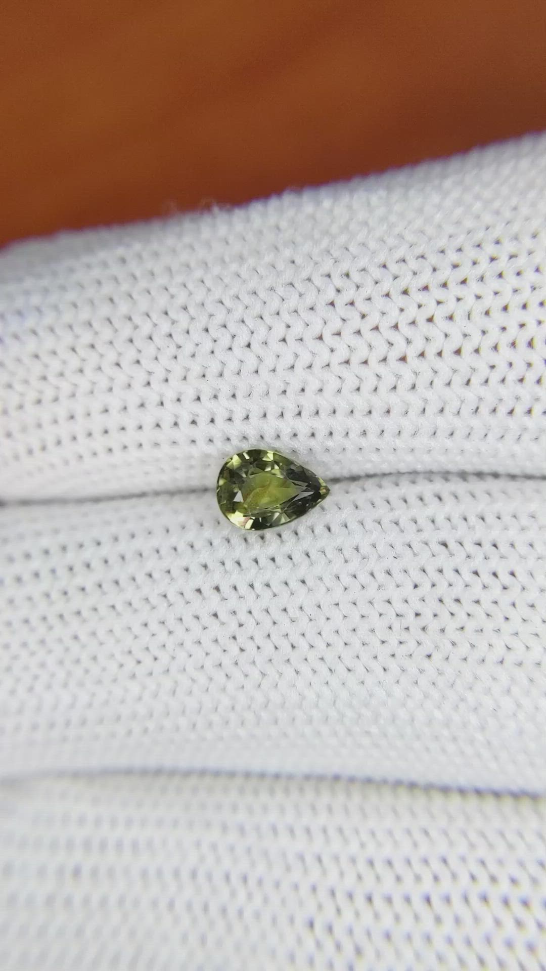 0.76 Ct. Greenish Yellow Sapphire from Madagascar Size Video