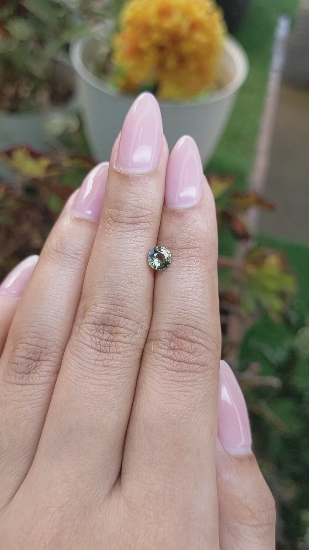 0.62 Ct. Yellowish Green Sapphire from Madagascar Size Video