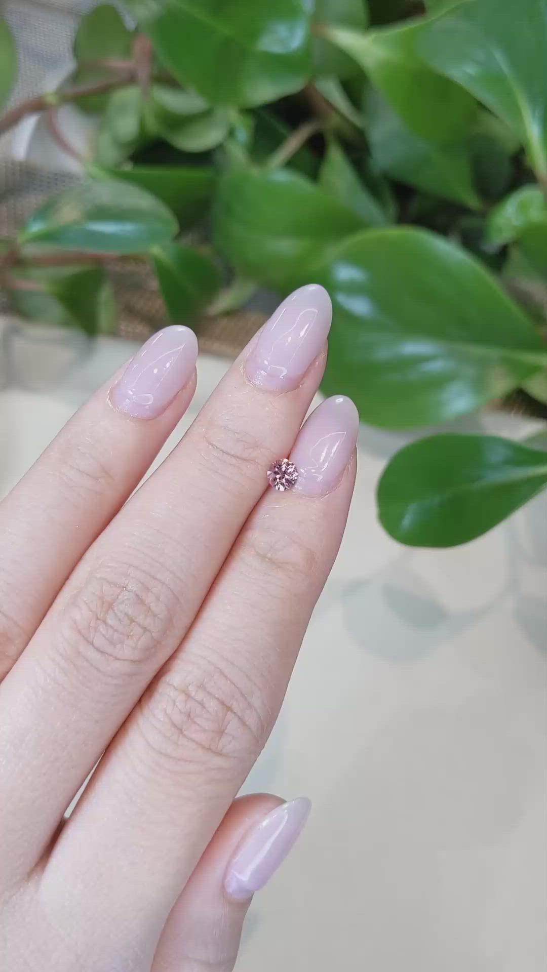 0.38 Ct. Pinkish Brown Sapphire from Montana Size Video