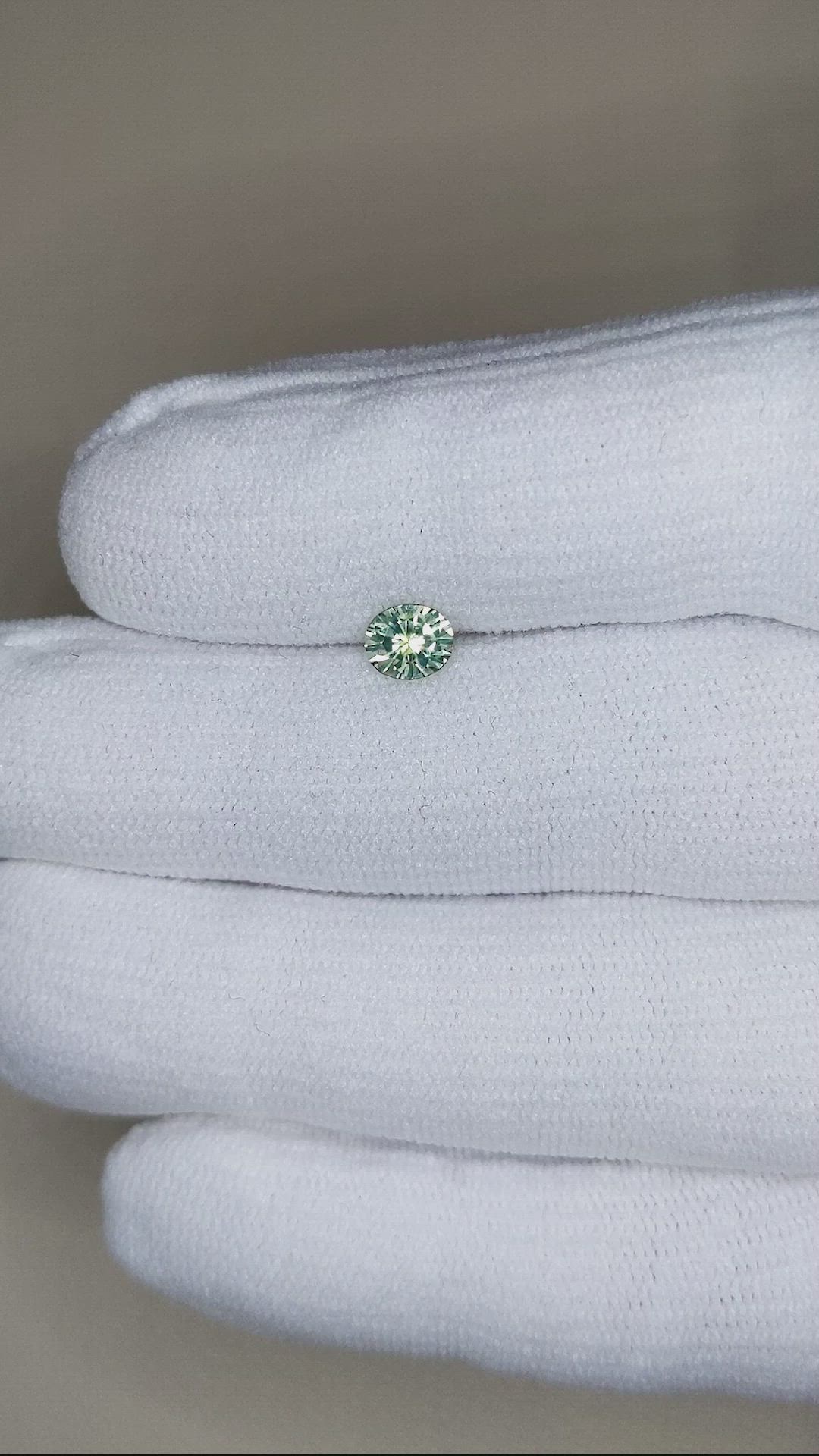0.57 Ct. Yellowish Green Sapphire from Montana Size Video